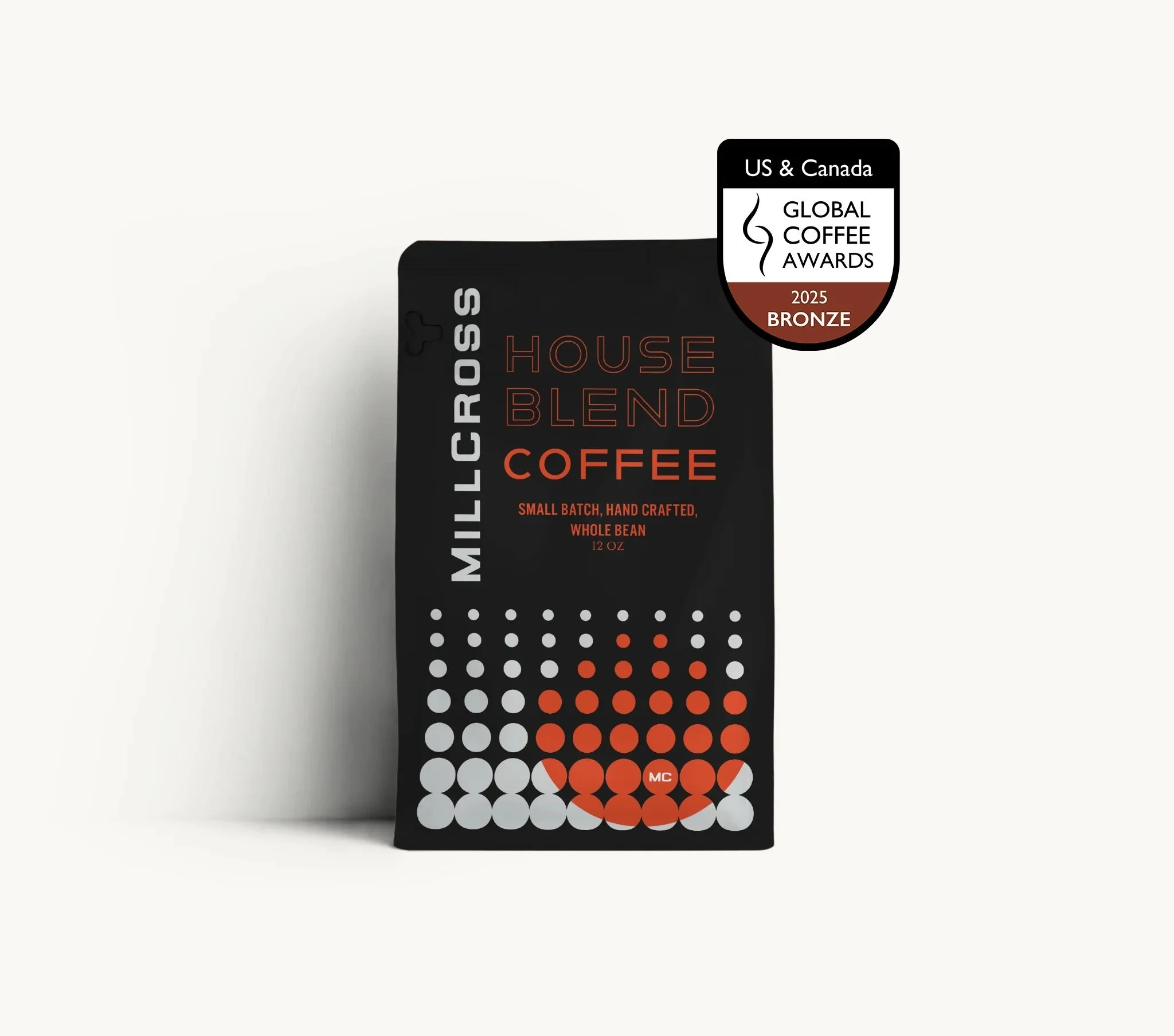 Black packaging of Millicross House Blend Coffee with a badge indicating it won a bronze award at the 2025 US & Canada Global Coffee Awards.