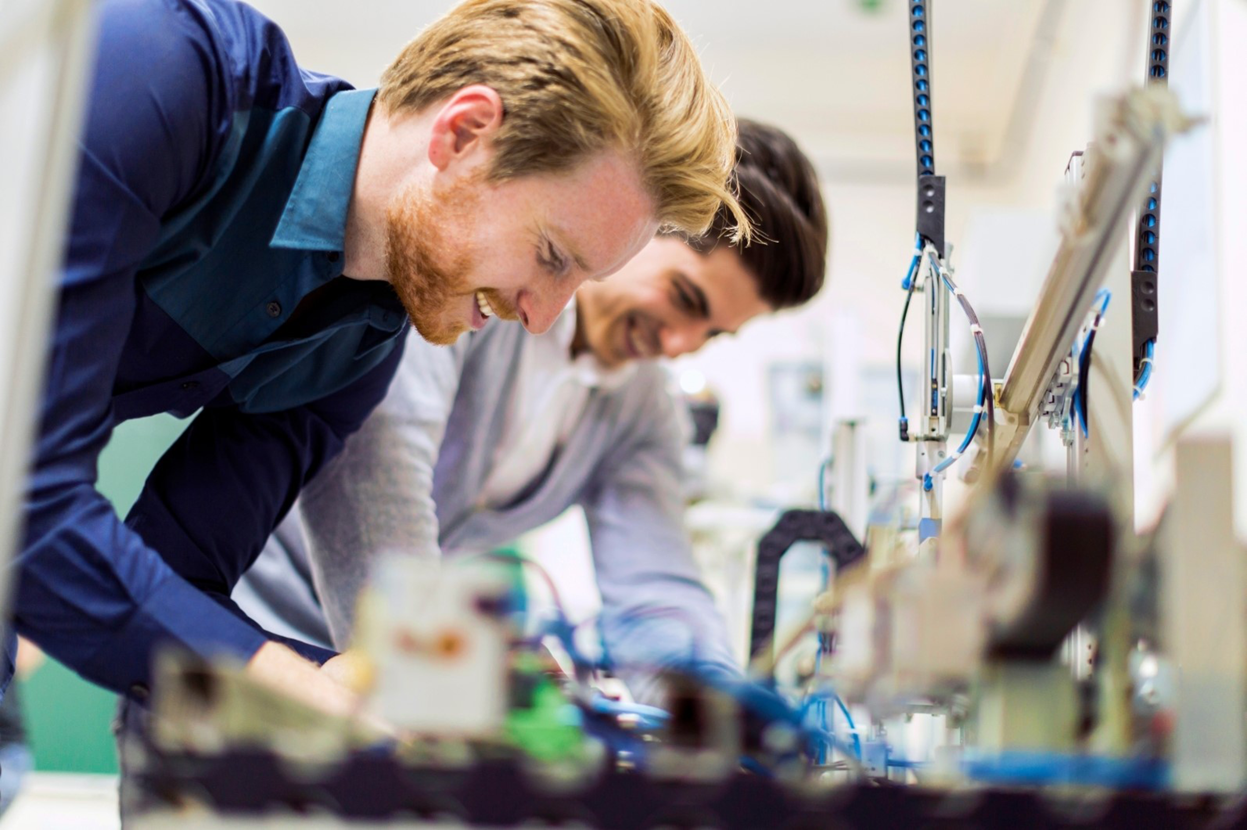 11 Two Engineers Smiling While Working.png