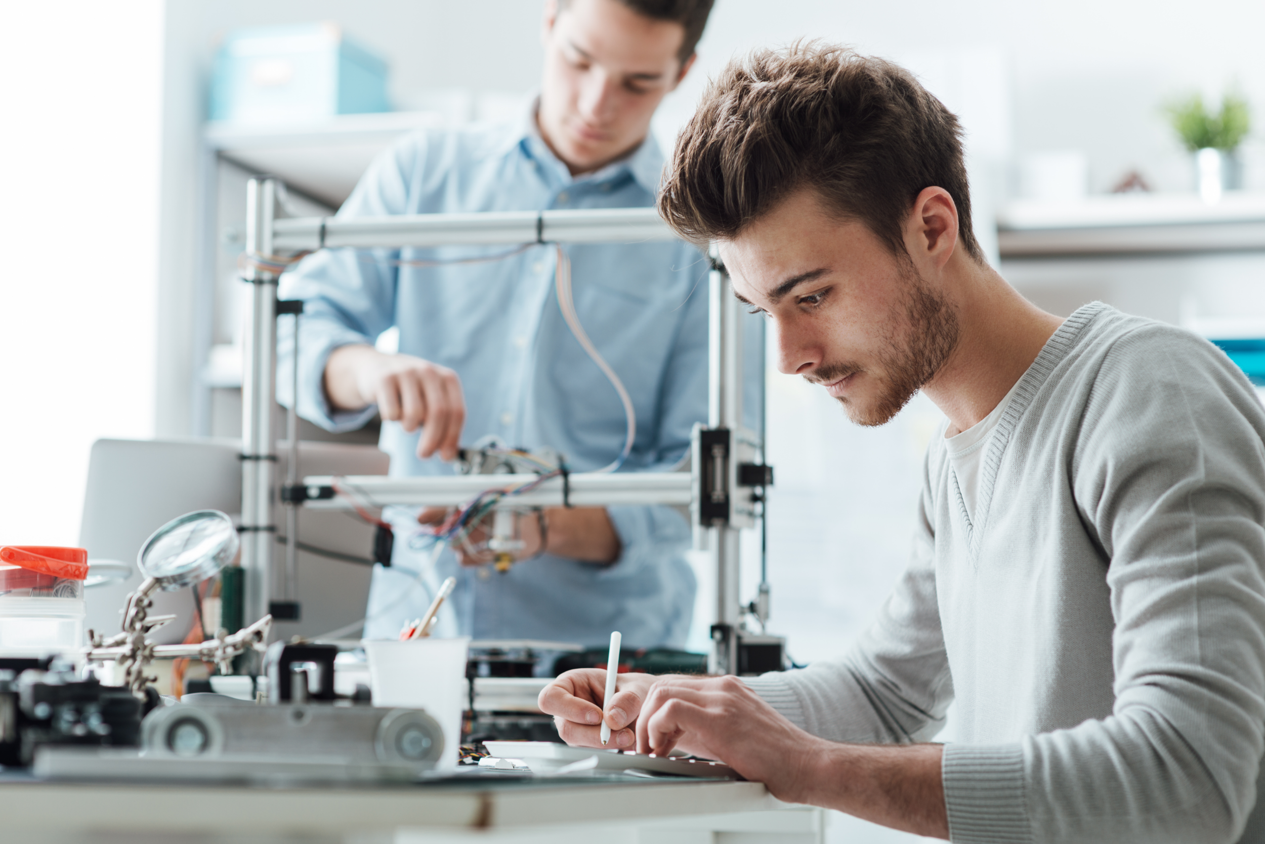 04 Male Students in Engineering Lab.png
