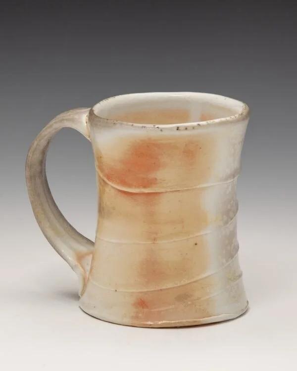 Porcelain mug with shino lining,
4.5" x 4" -
Wood and soda fired
- SOLD