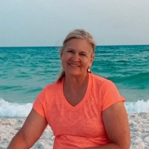 woman on beach smiling