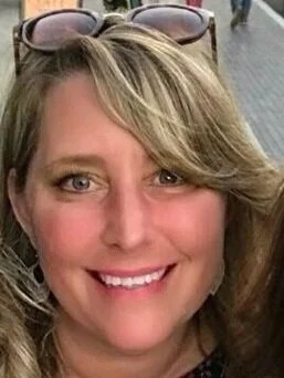 woman in sunglasses smiling