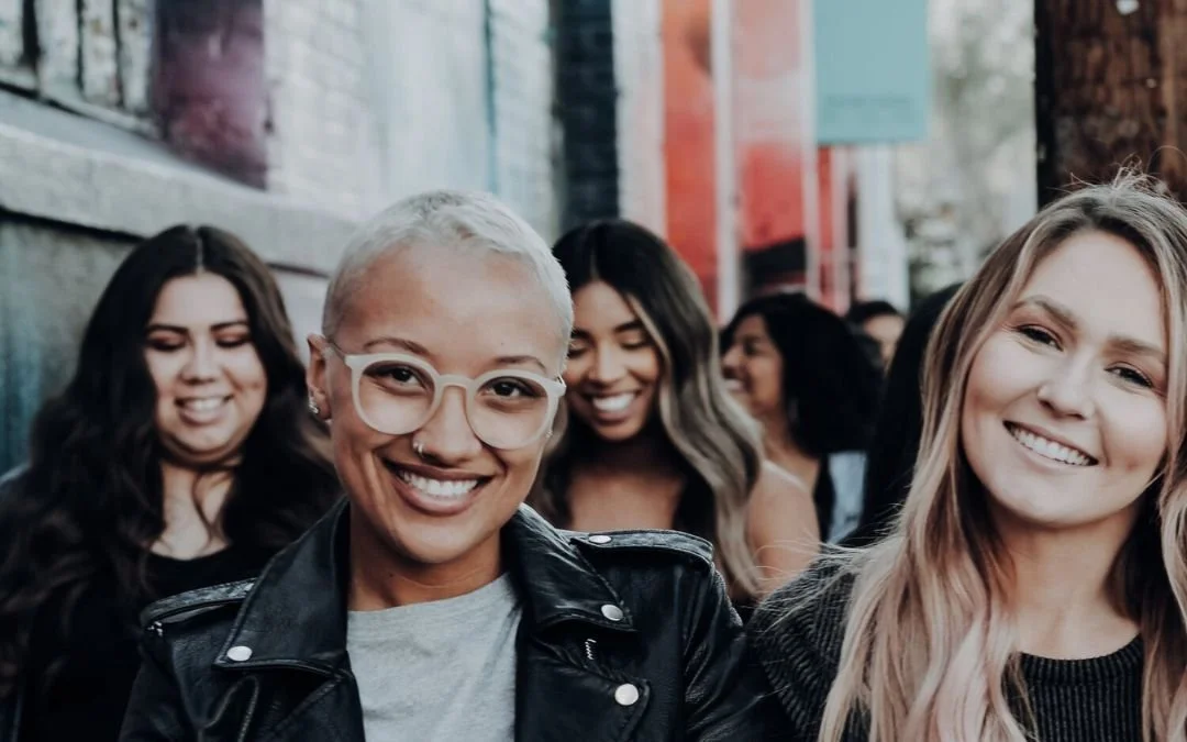 women on the sidewalk in vibrant city street