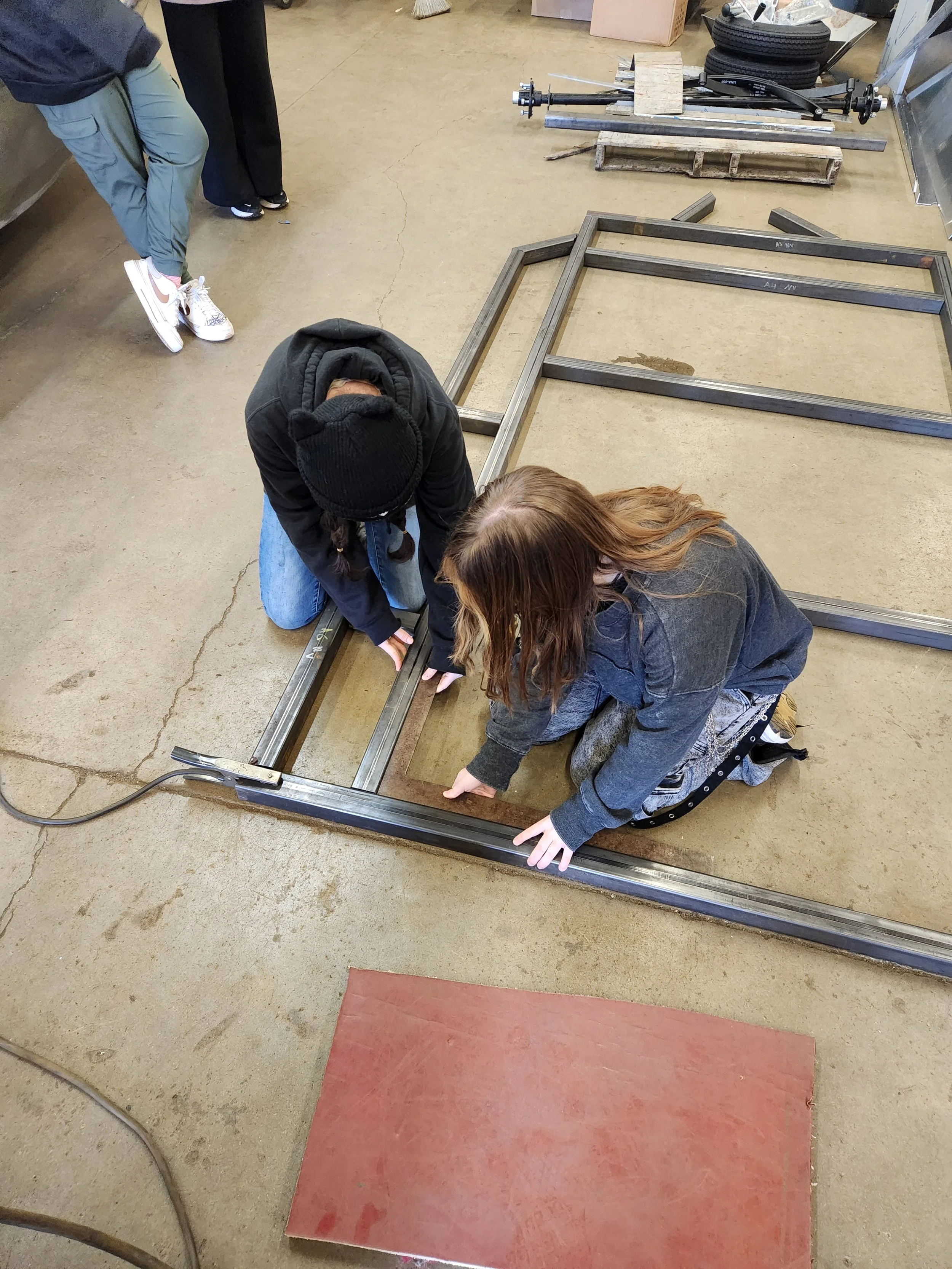 Cindel and Alyssa working on trailer..jpg