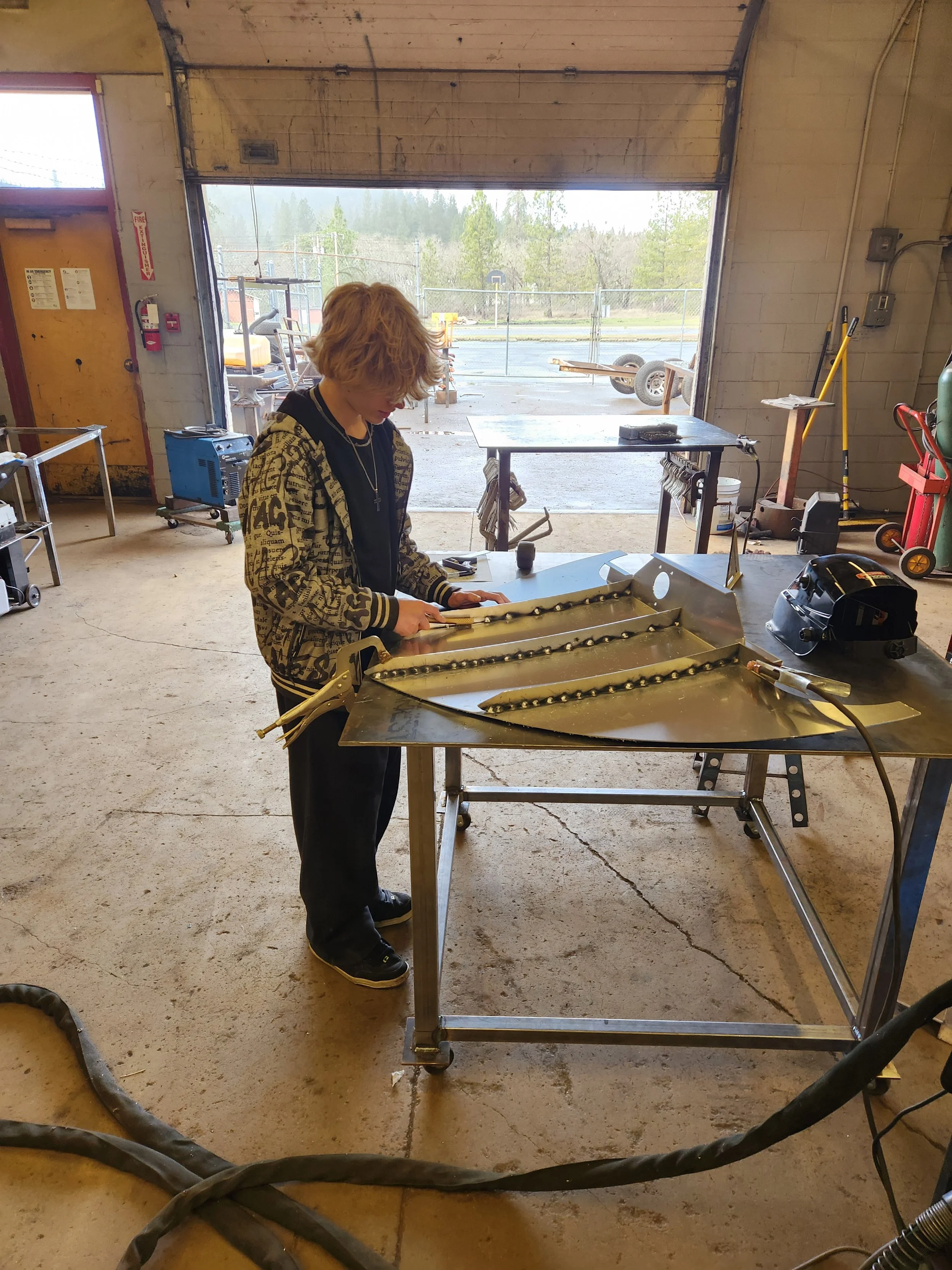 Jacob cleaning underside of bow..jpg