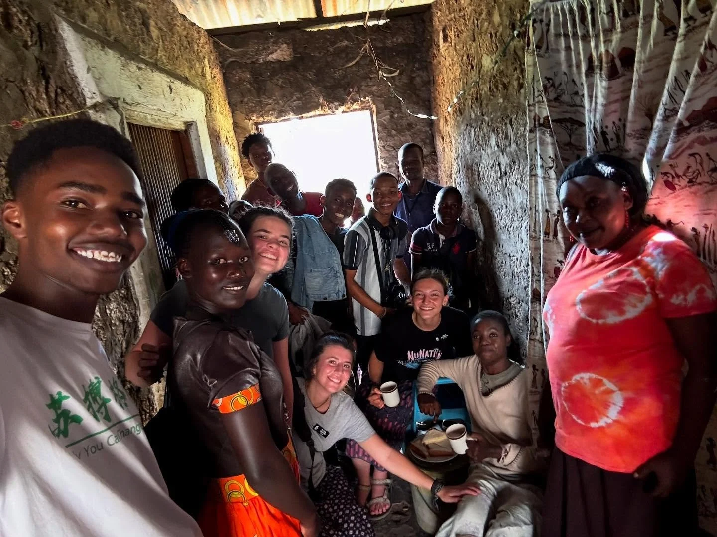 ✍🏽Excerpt from the blog from Summer Intern Trainee Olivia Lasater (lower center, arm outstretched). Note: The same impactful home visit was also covered in blogs by Immersion Trainee Erin Gammill and Summer Intern Ann Marie Sterling. Read all the bl