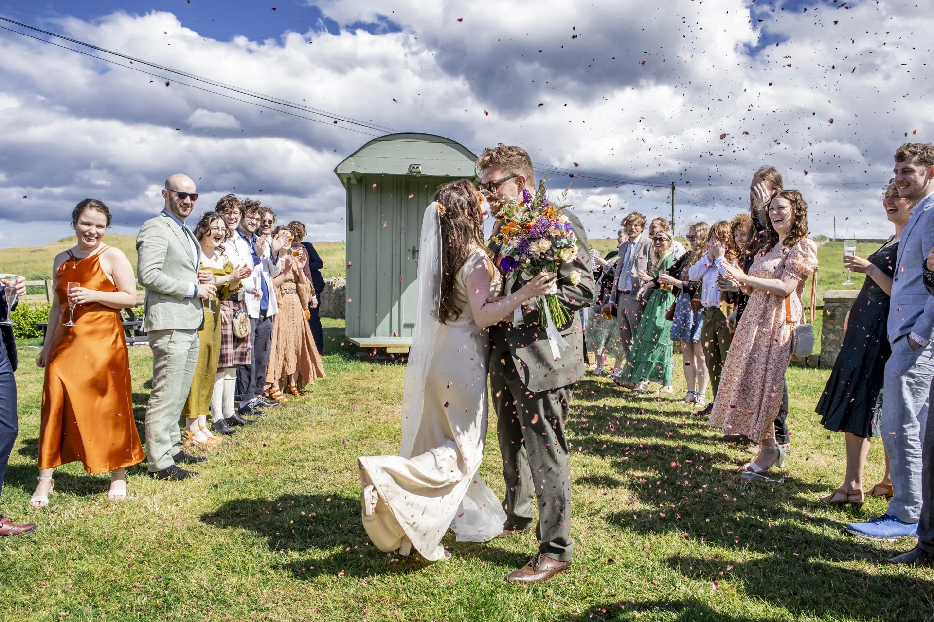 Confetti moment during a countryside wedding