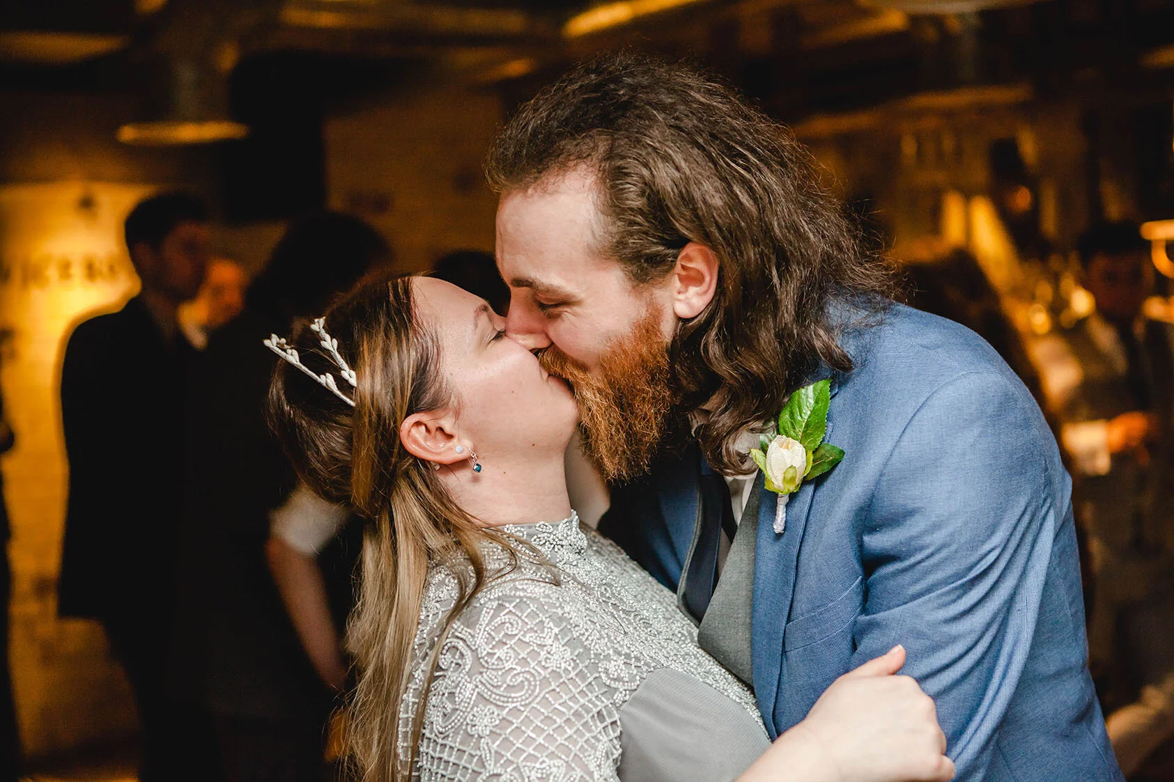 Bride and groom sharing a kiss during their non-traditional wedding reception at Pleased to Meet You, after ceremony at Newcastle Civic Centre