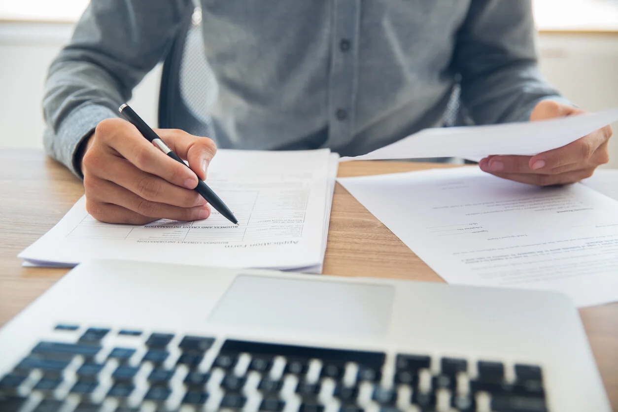 A professional data-driven desktop machinery and equipment appraisal report being completed remotely.