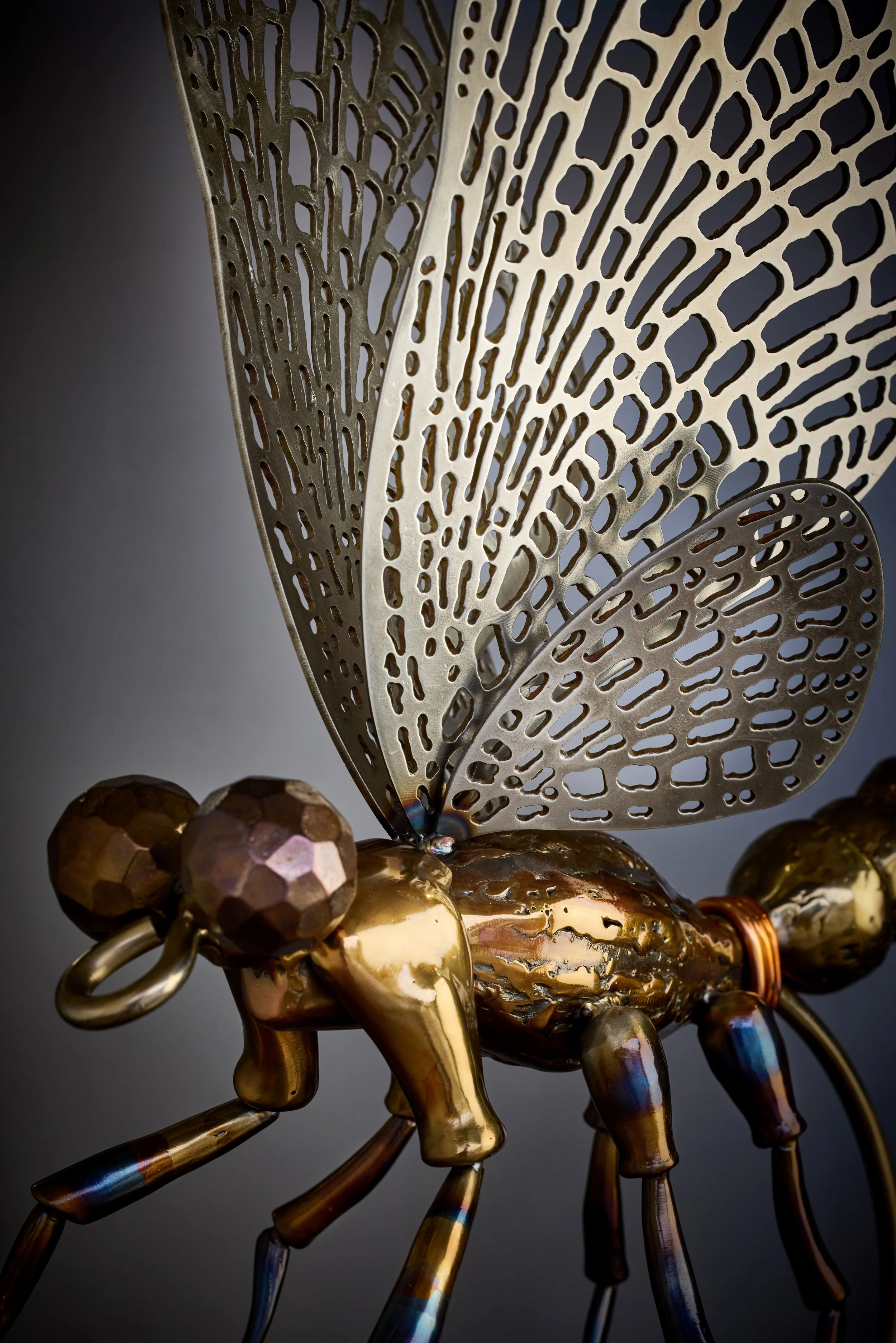A luxury handcrafted metal sculpture designed for discerning art collectors. Composed of meticulously detailed metals and refined detailing, this heirloom-quality piece captures the elegance of classic fly patterns. 
