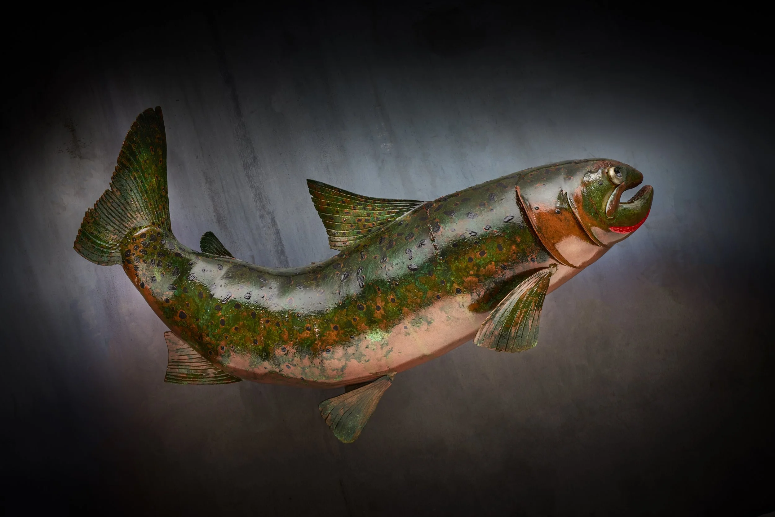 The Copper Cutthroat sculpture, crafted with steel and copper to bring the Montana State fish to life. This fine art now resides in the Missoula Airport as a public art display.