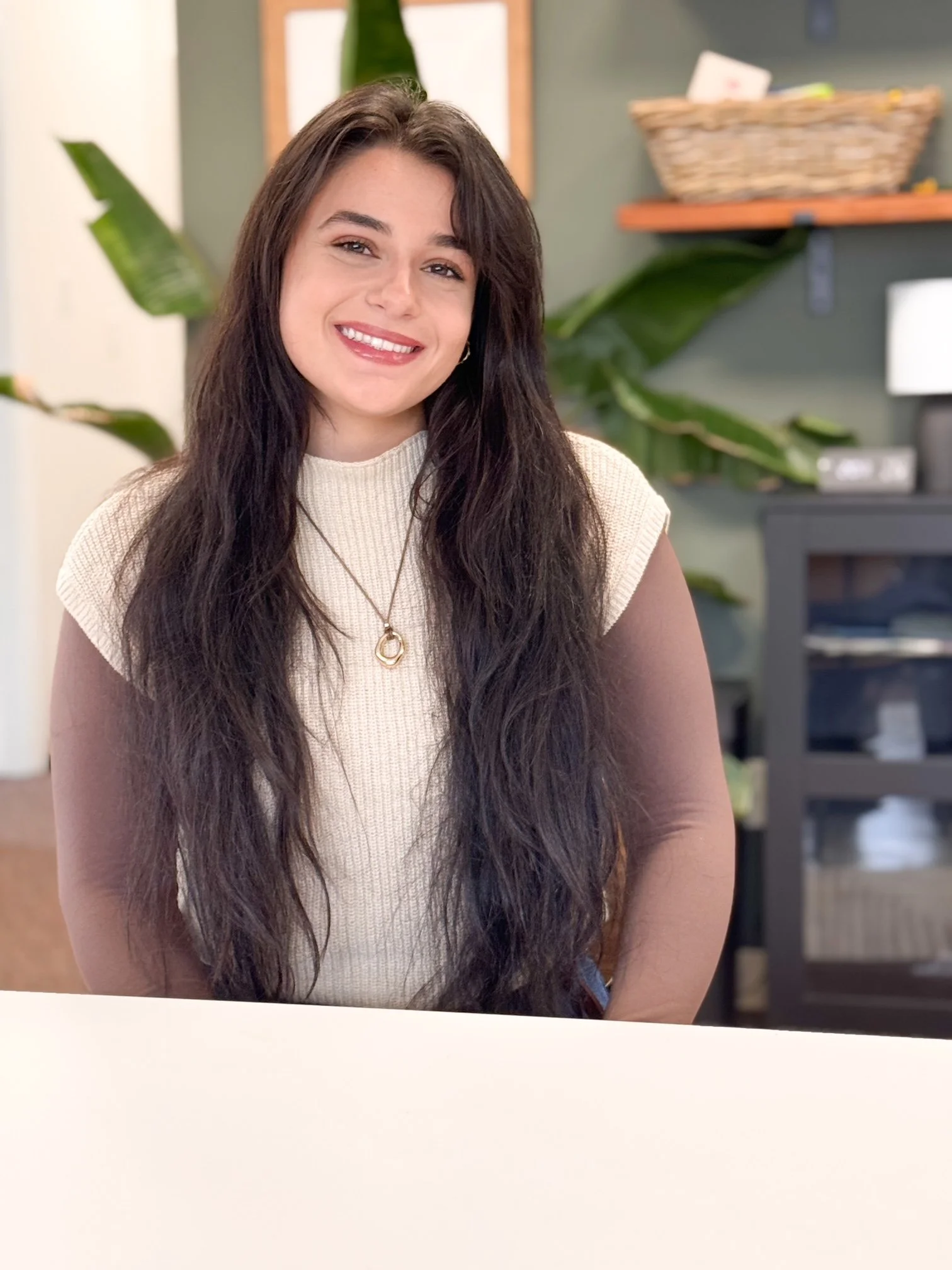 This is Adrianna sitting at a desk in our mental health therapy office.