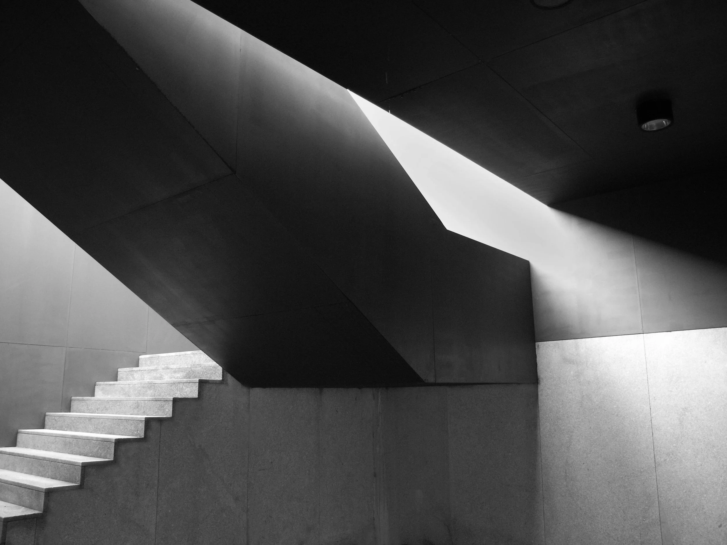 Minimal concrete staircase with light and shadow