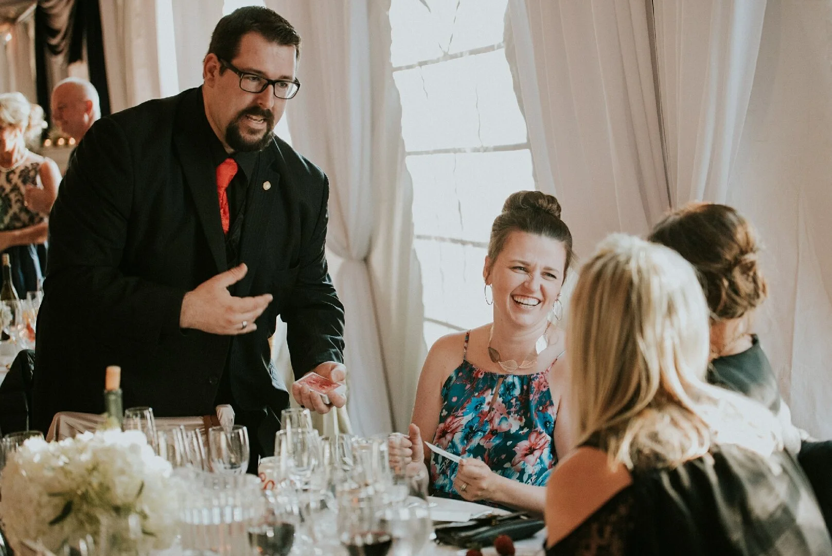 Kyle Elder performing strolling close-up magic for wedding guests
