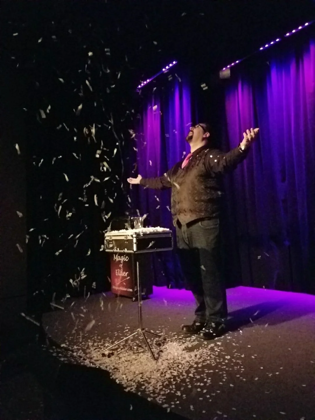 Kyle Elder performing corporate magic for an audience