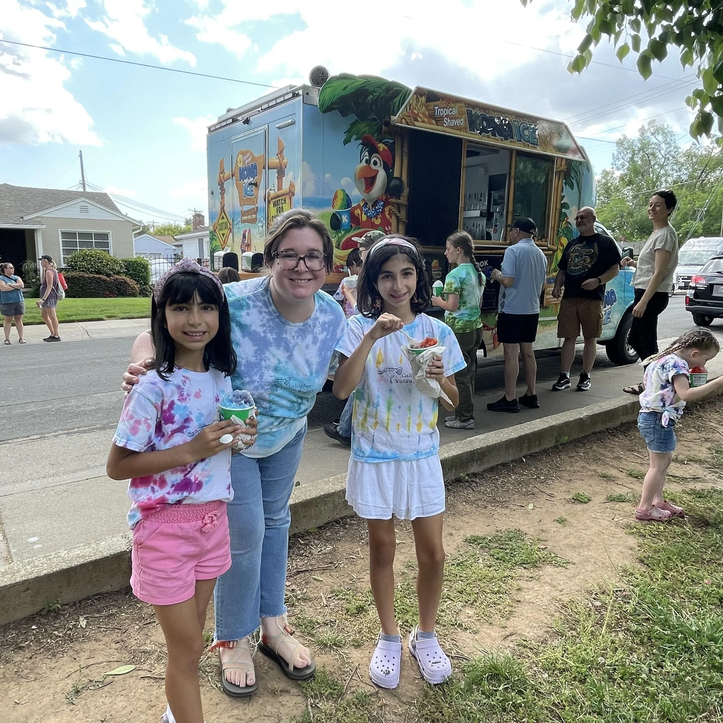 Suzuki Violin School Volume 1 and 2 students post group class performance at East Portal Park in Sacramento enjoying Kona Ice from West Sacramento