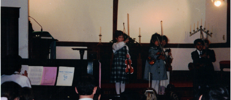 Kathleen Gallagher-McLellan as a Suzuki violin student.