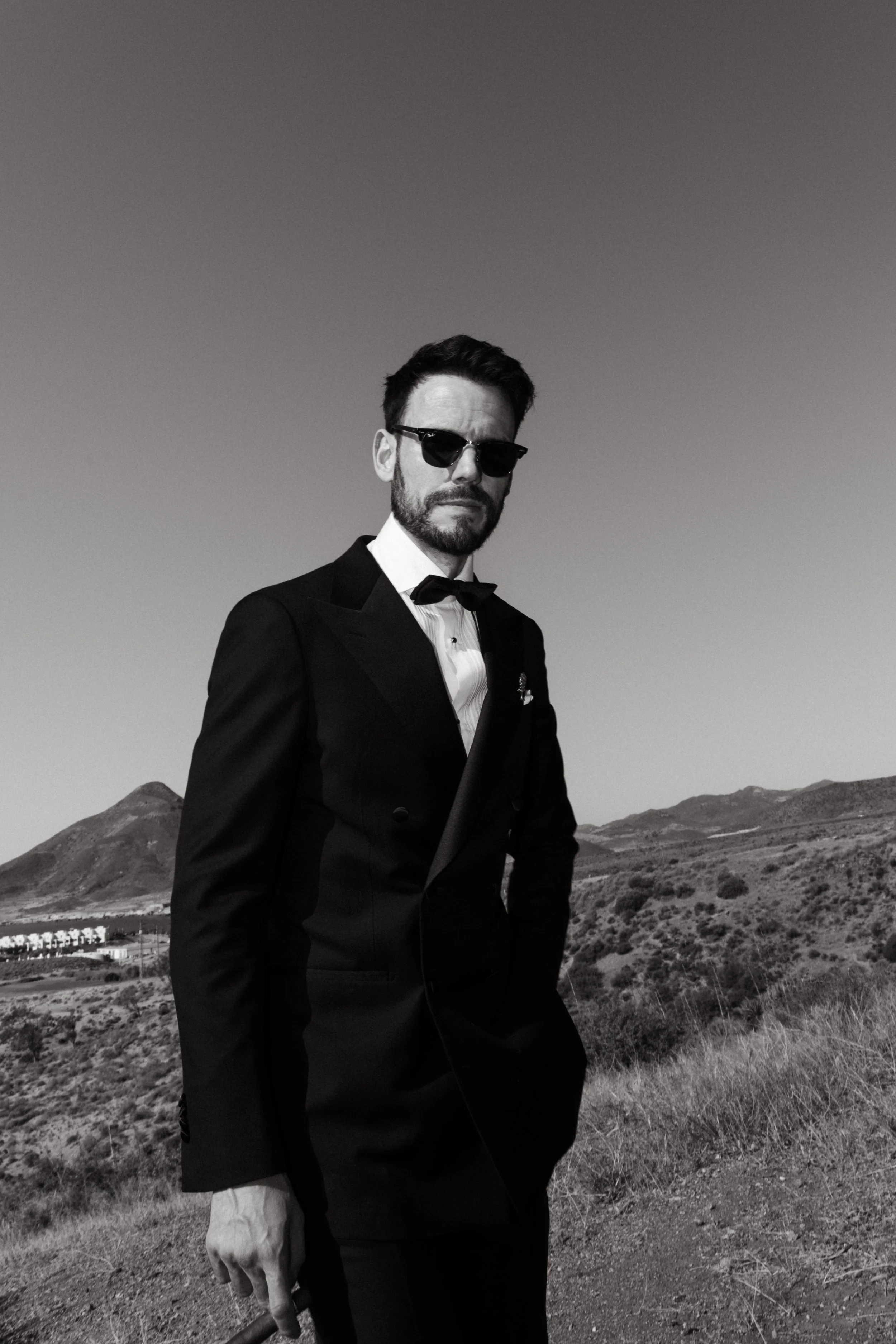Fashion-forward groom portrait during wedding preparations