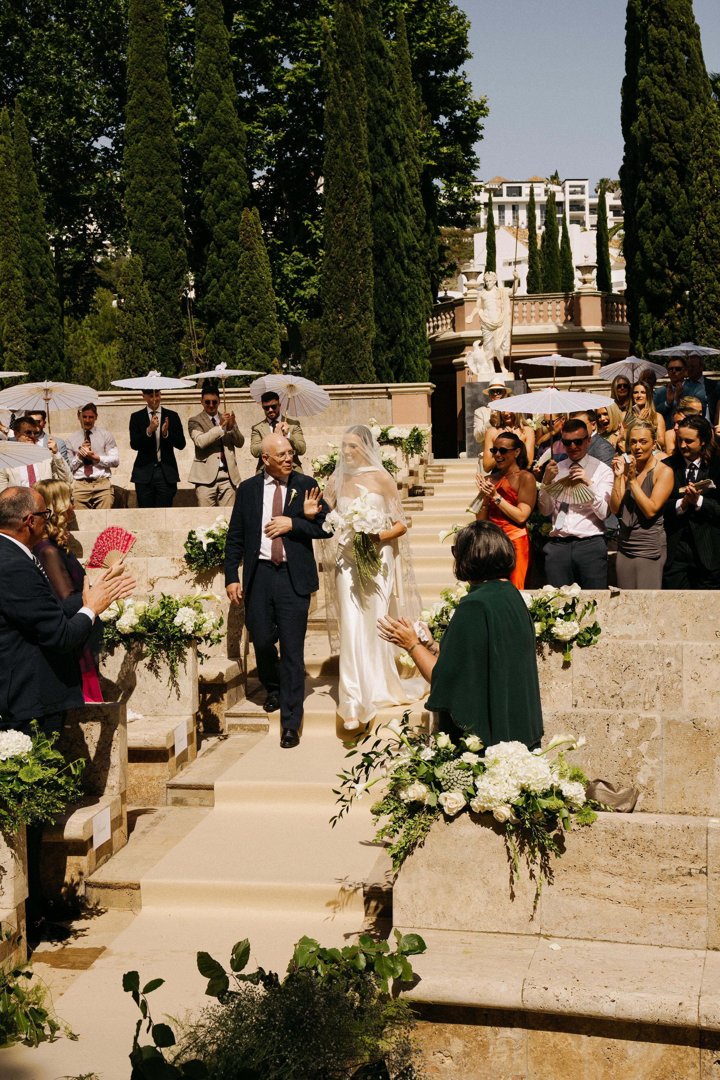 Bride walking aisle Marbella destination wedding Spain