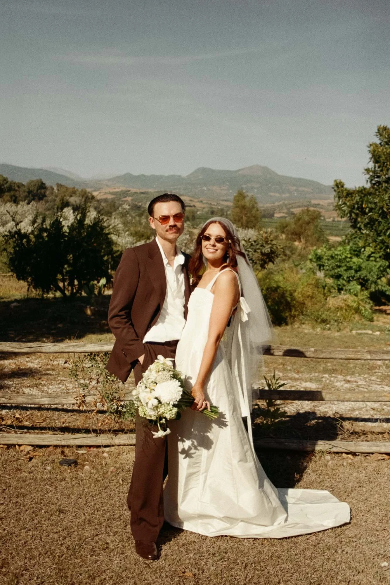 Editorial wedding portraits in Spain with relaxed posing and fashion forward influence