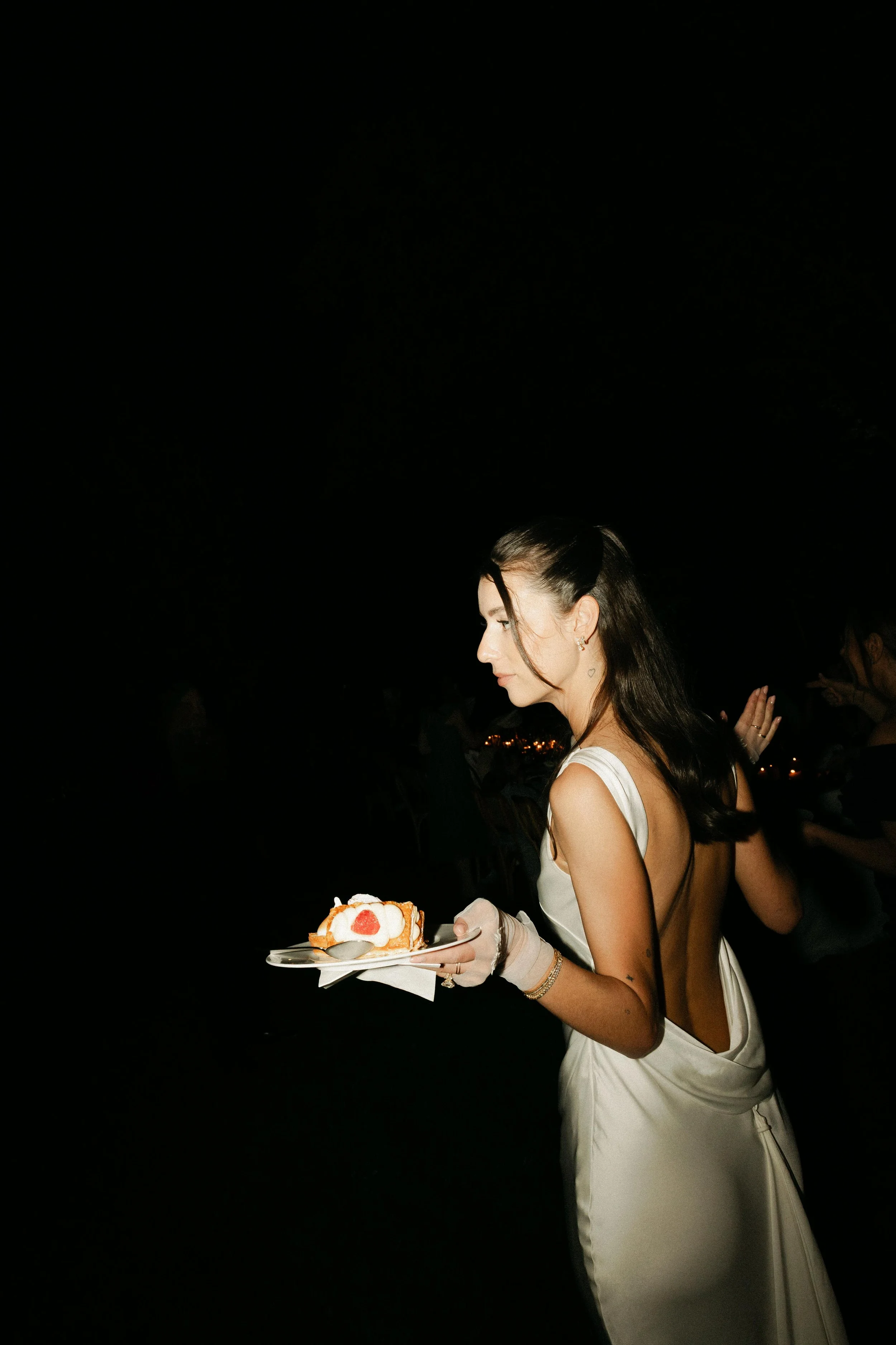 Editorial wedding photographer Spain documenting thoughtful wedding styling and the bride with the cakes