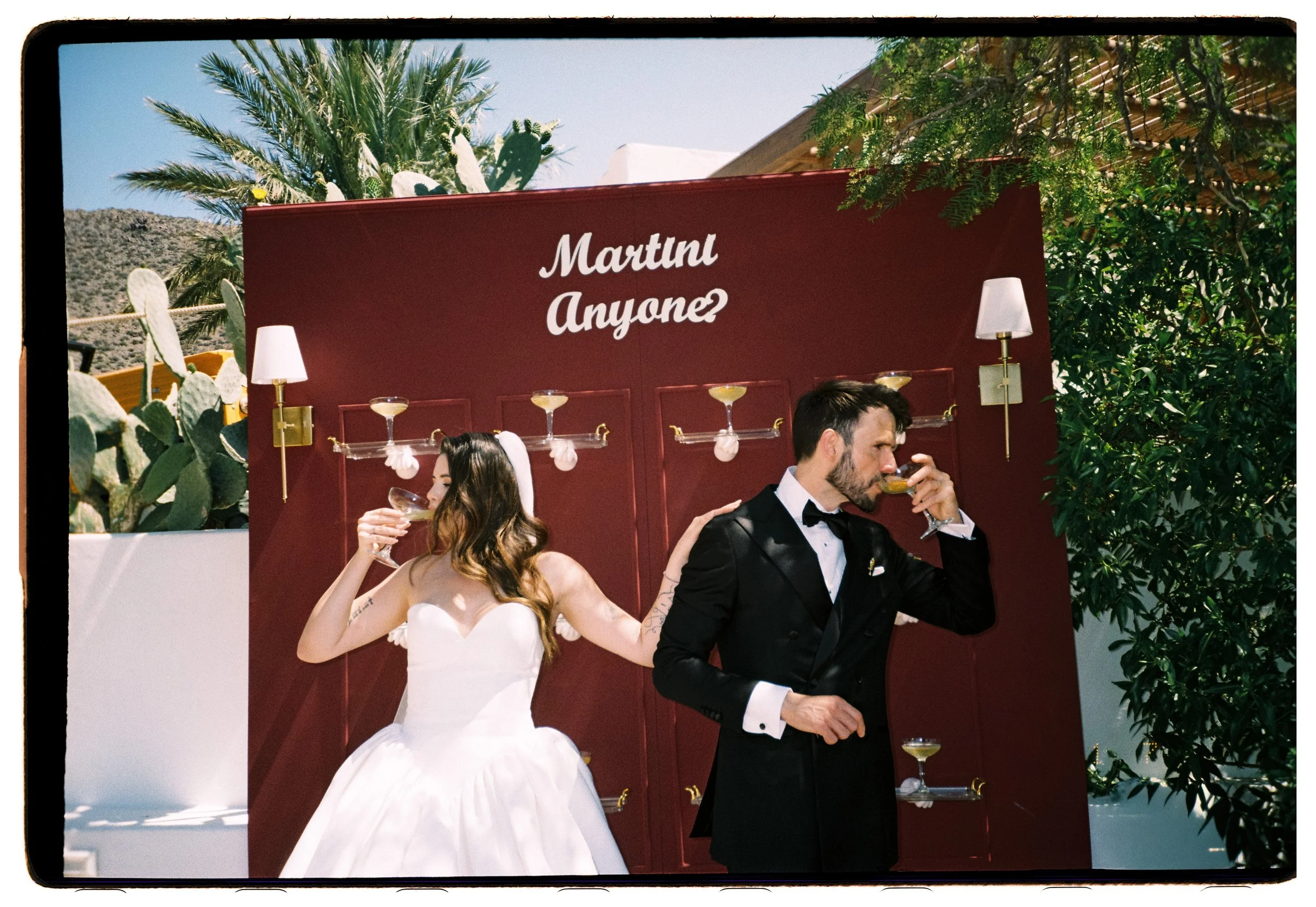 Dramatic purple Martini wall at a destination wedding