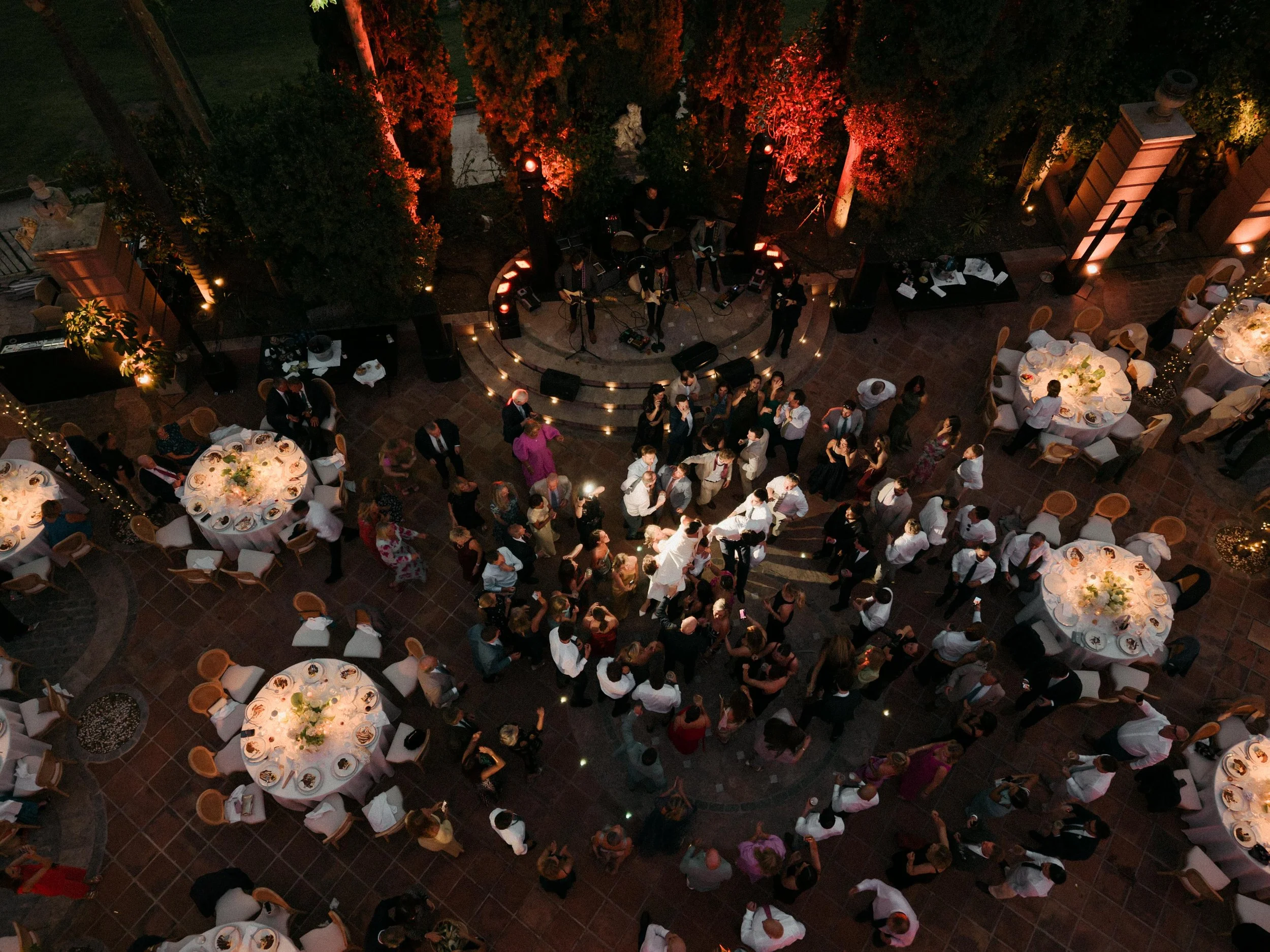 Crowd dancing Marbella destination wedding Spain from the air with a drone