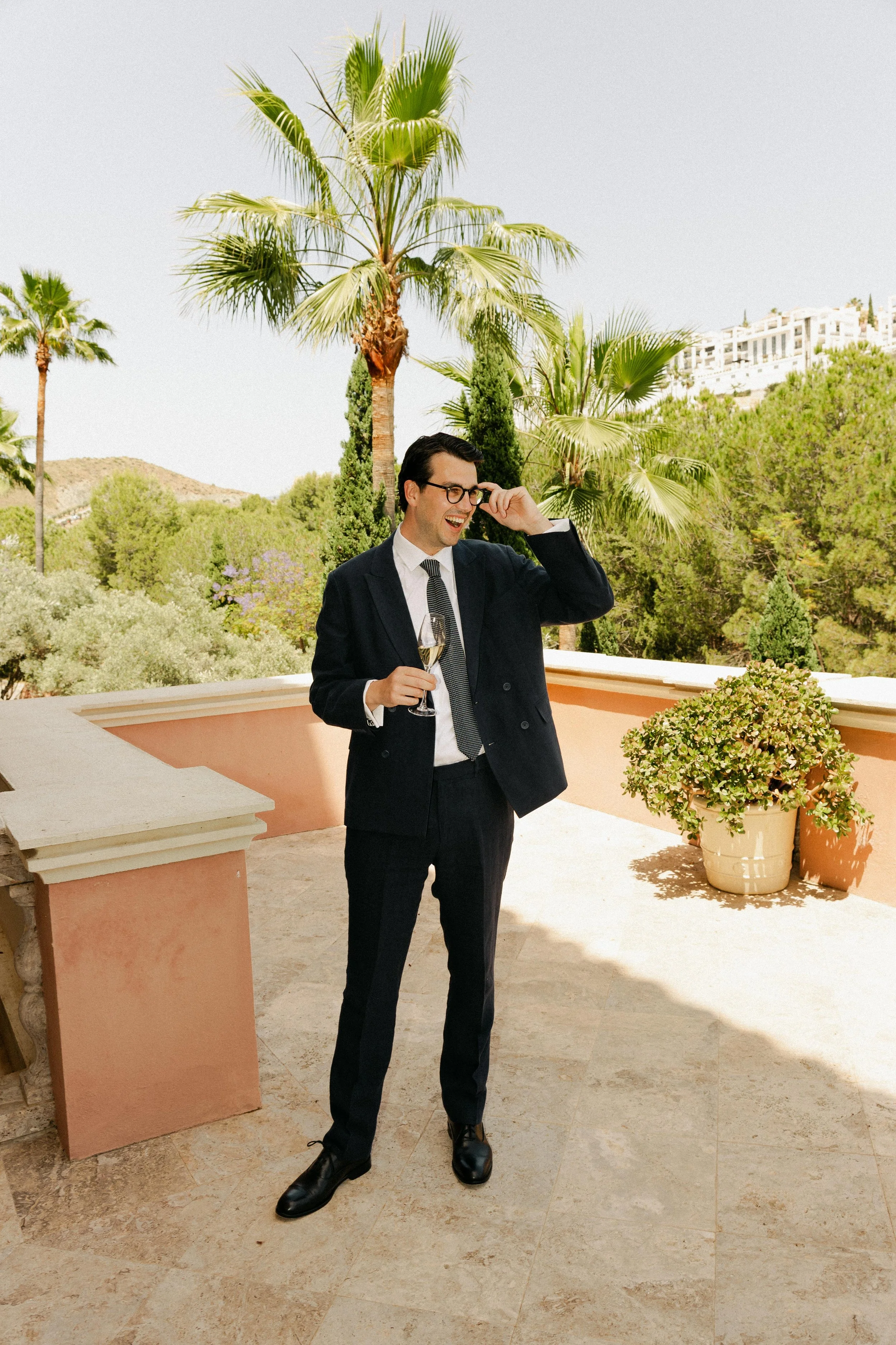 Groom champagne wedding morning Marbella villa Spain