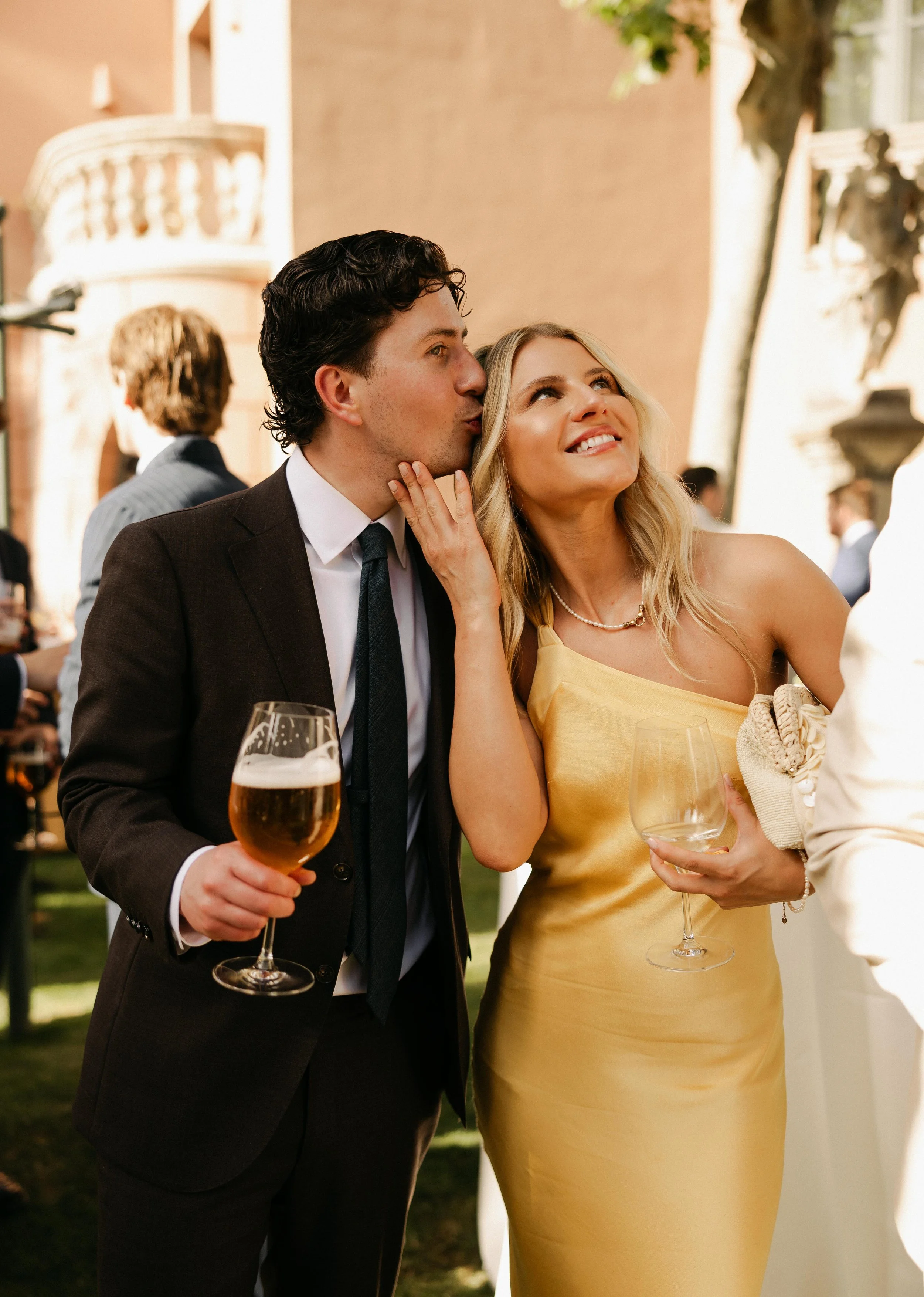 Candid laughter cocktail hour Marbella destination wedding Spain