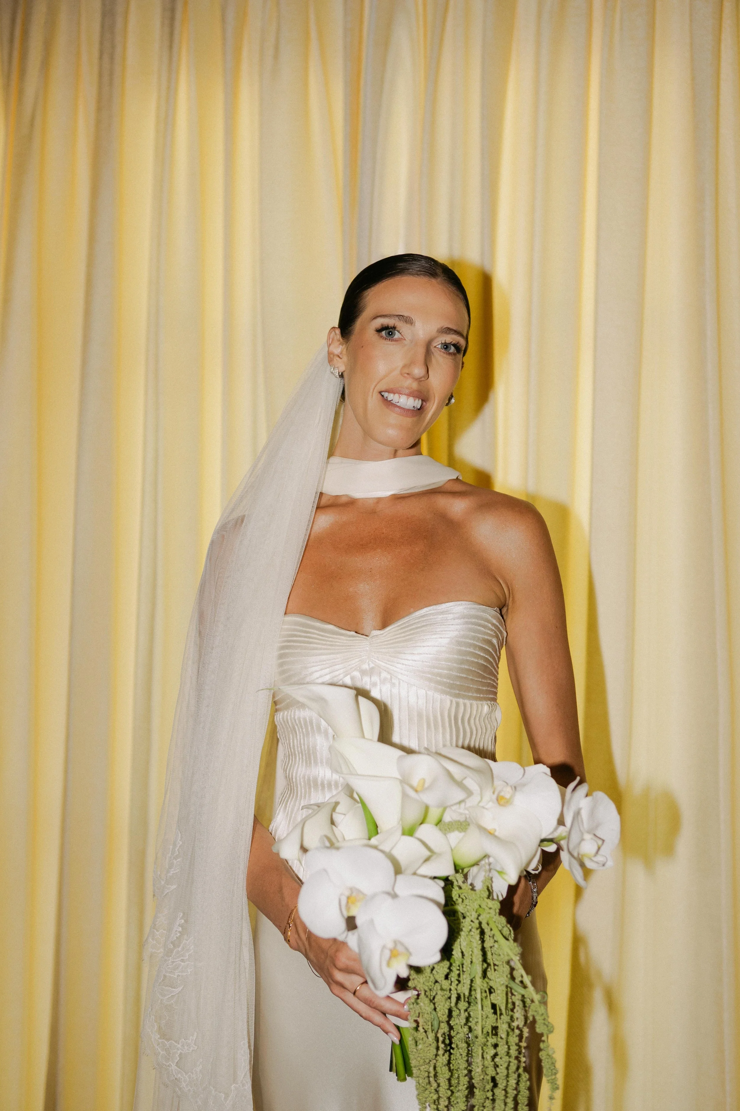 Editorial bride portrait of the bride holding orchid and calla flower bouquet Marbella villa photography Spain
