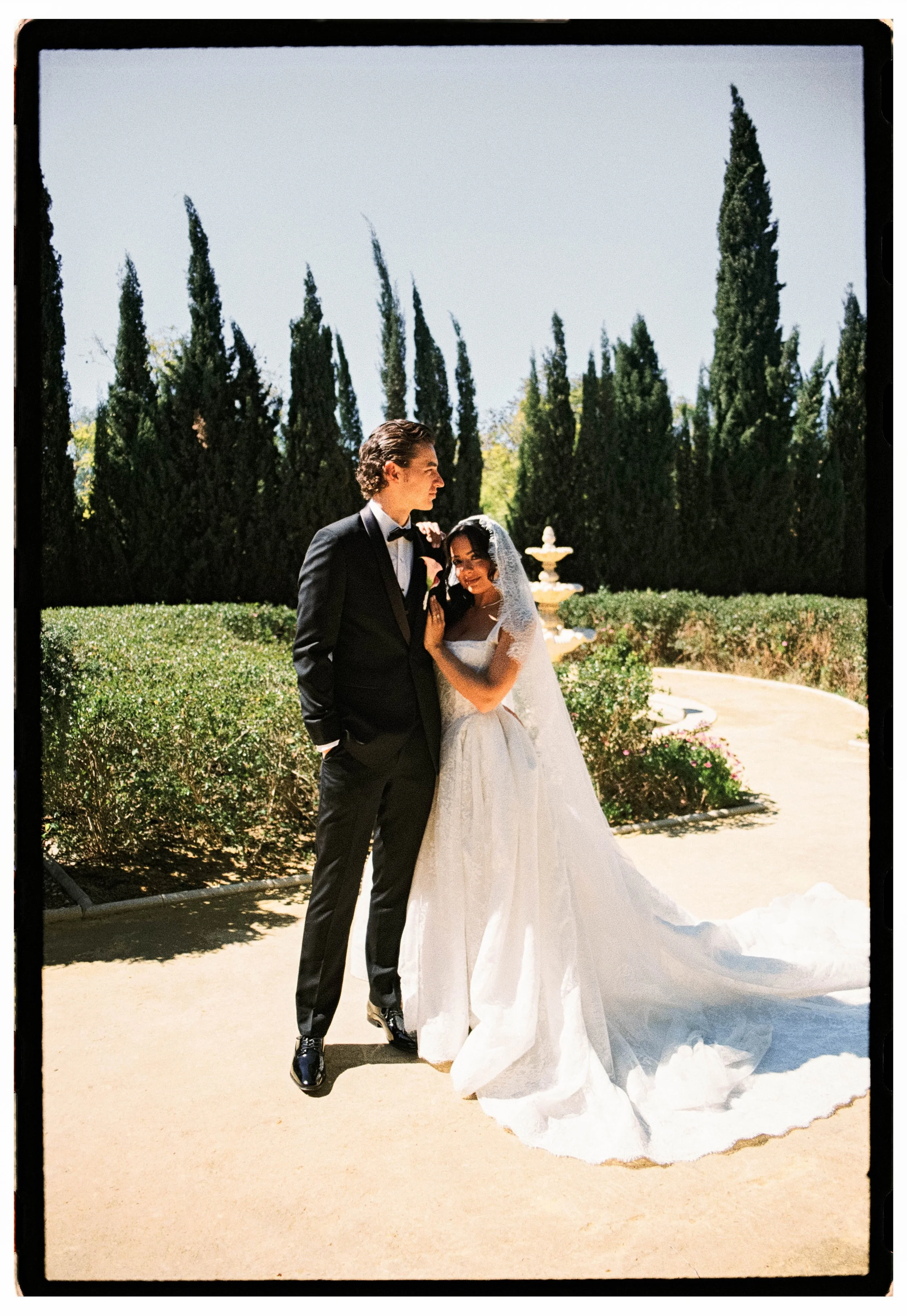 Italy wedding photographer uses gentle direction to guide bride and groom for an editorial film wedding portrait