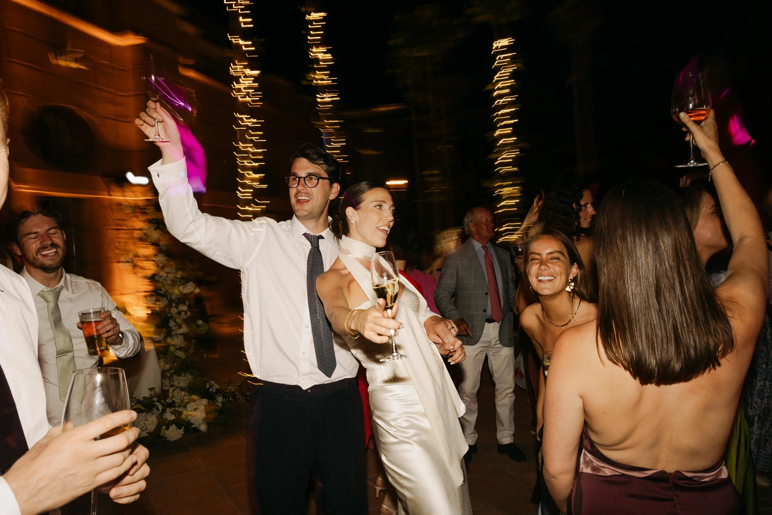 Guests dancing under lights Marbella destination wedding Spain