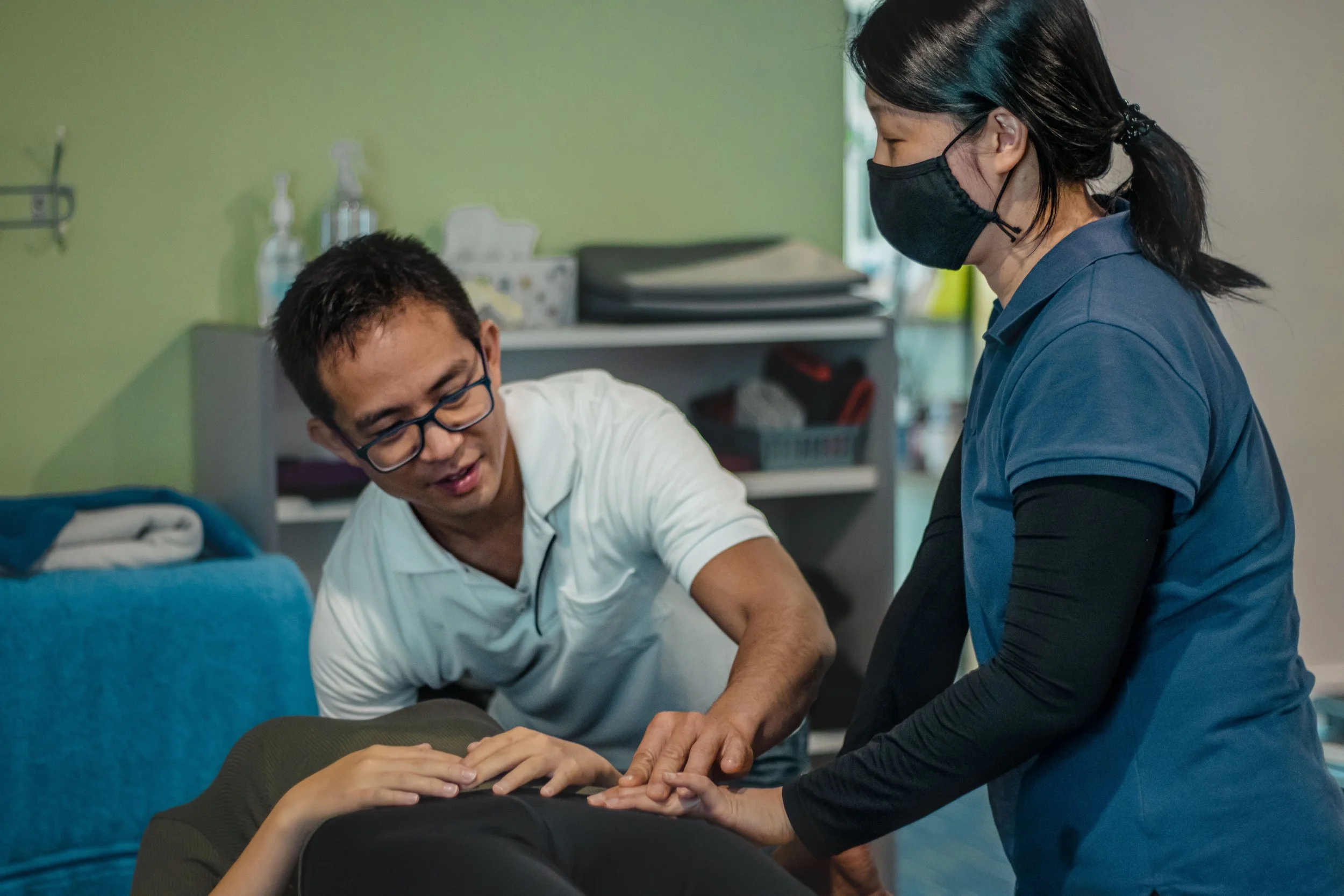 Gallery: Dr Lin and staff adjusting treatment equipment