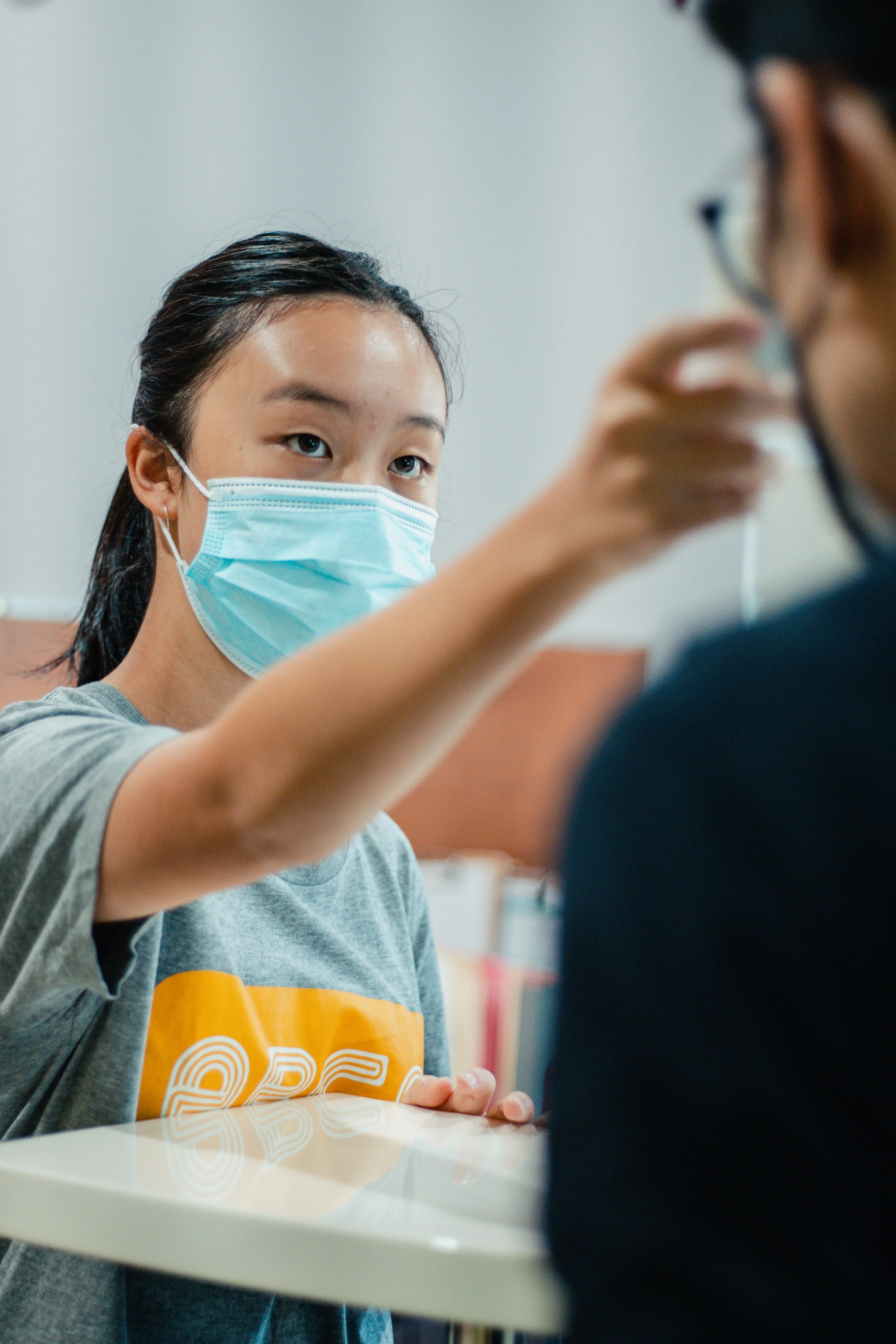 Gallery: Staff member takes patient's temperature