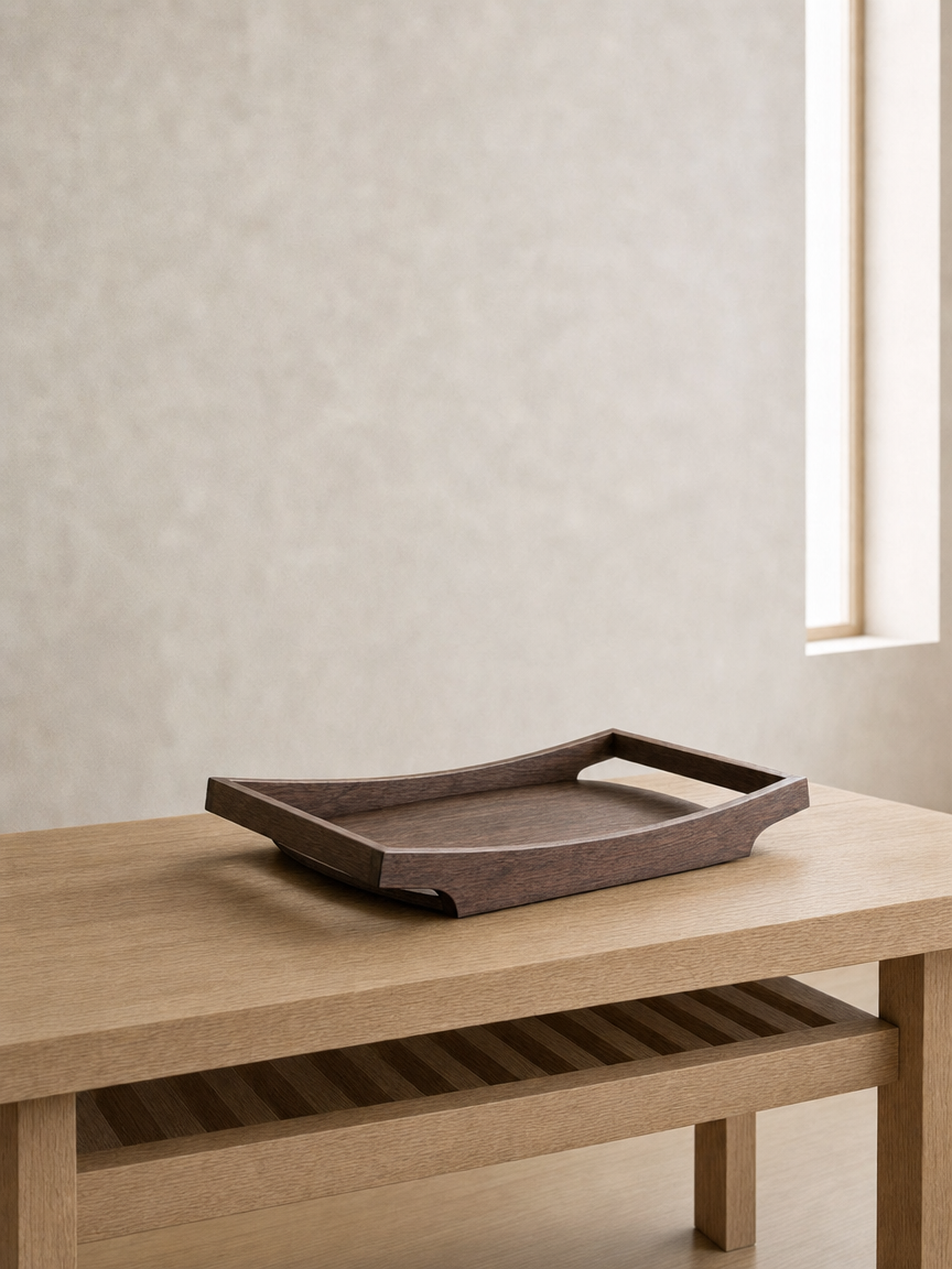 Empty wooden tray on a light wood table in a minimalistic room with beige walls and a narrow vertical window.