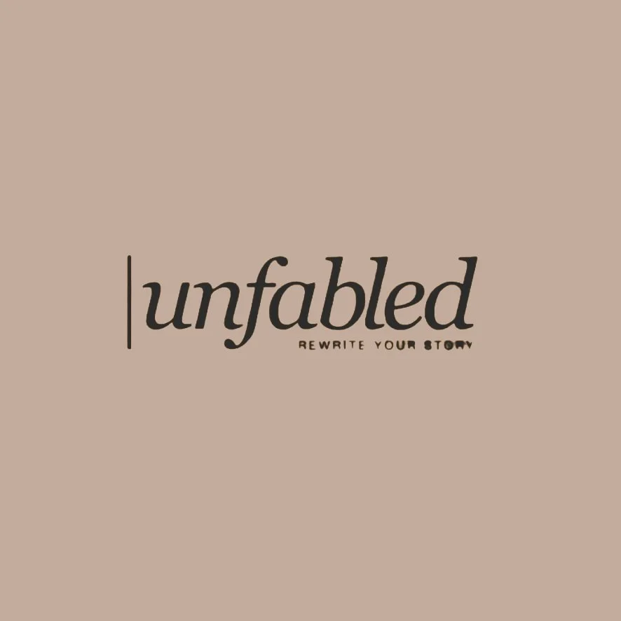 Logo for 'Unfabled' with the tagline 'Rewrite Your Story' in black text on a white background.
