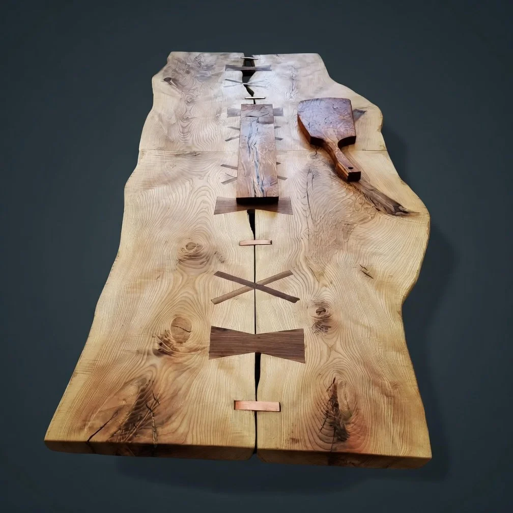 Ash live edge bookmatched table top with walnut bowties and copper inserts. 10 seater