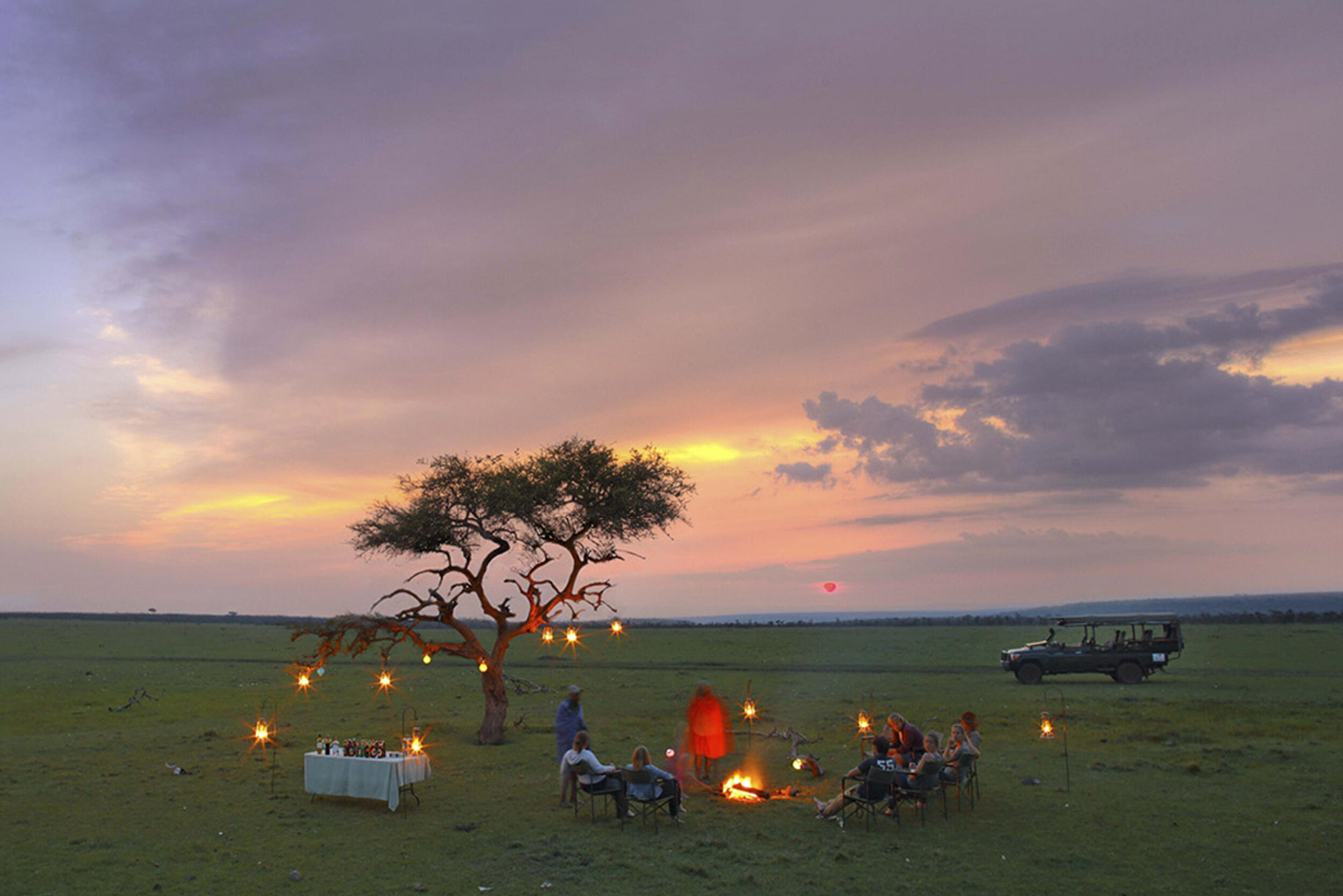 Naboisho Sundowners in the bush.jpg