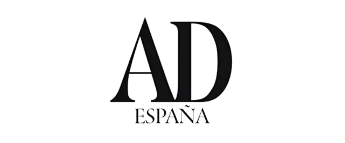 Black logo with the words 'AD ESTANA' beneath a stylized AK or AD monogram.