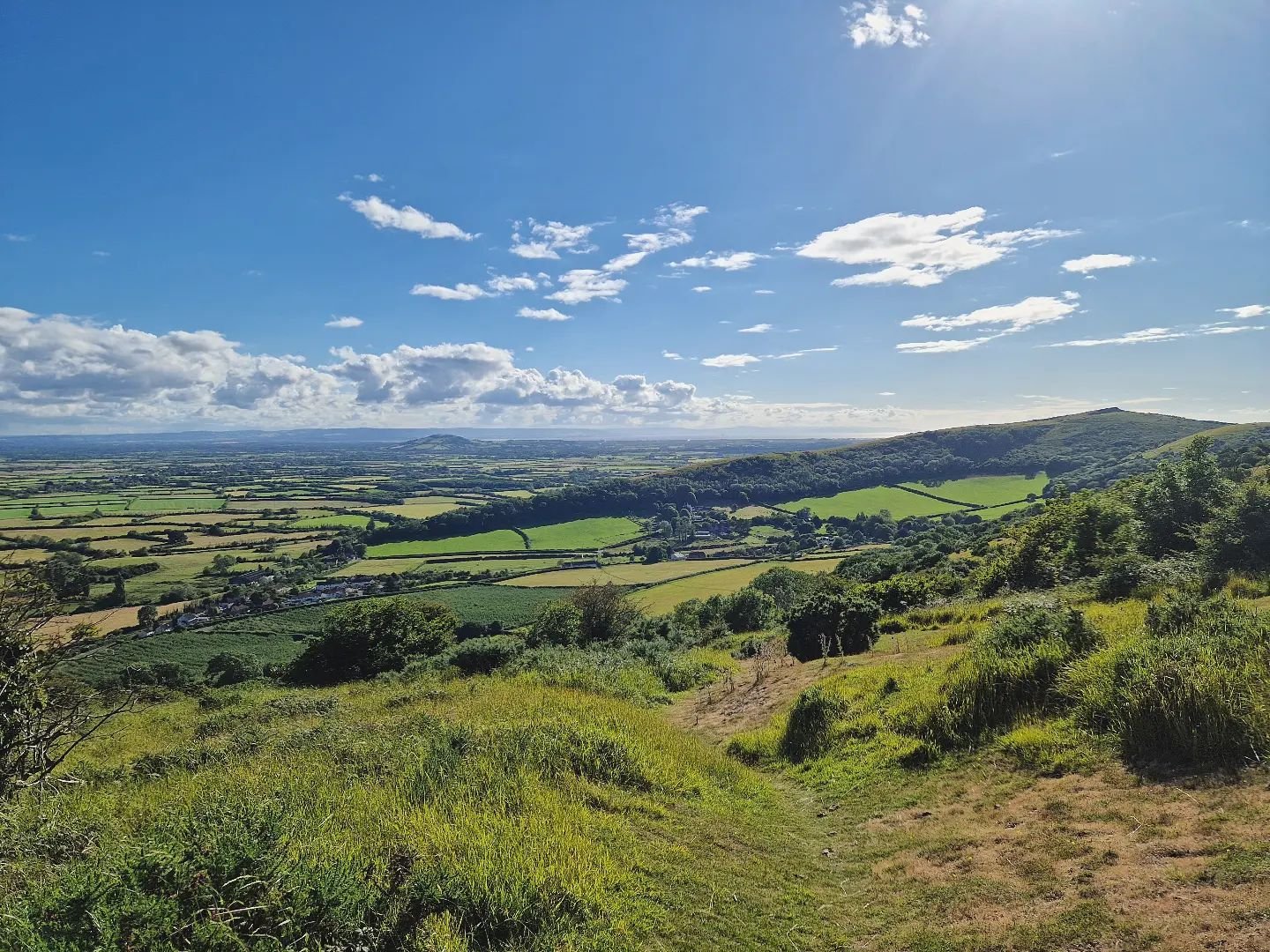 Not a bad evening to go for a run in the hills. Took a moment to look west at the top of Wavering Down towards Crook Peak - pretty stunning.