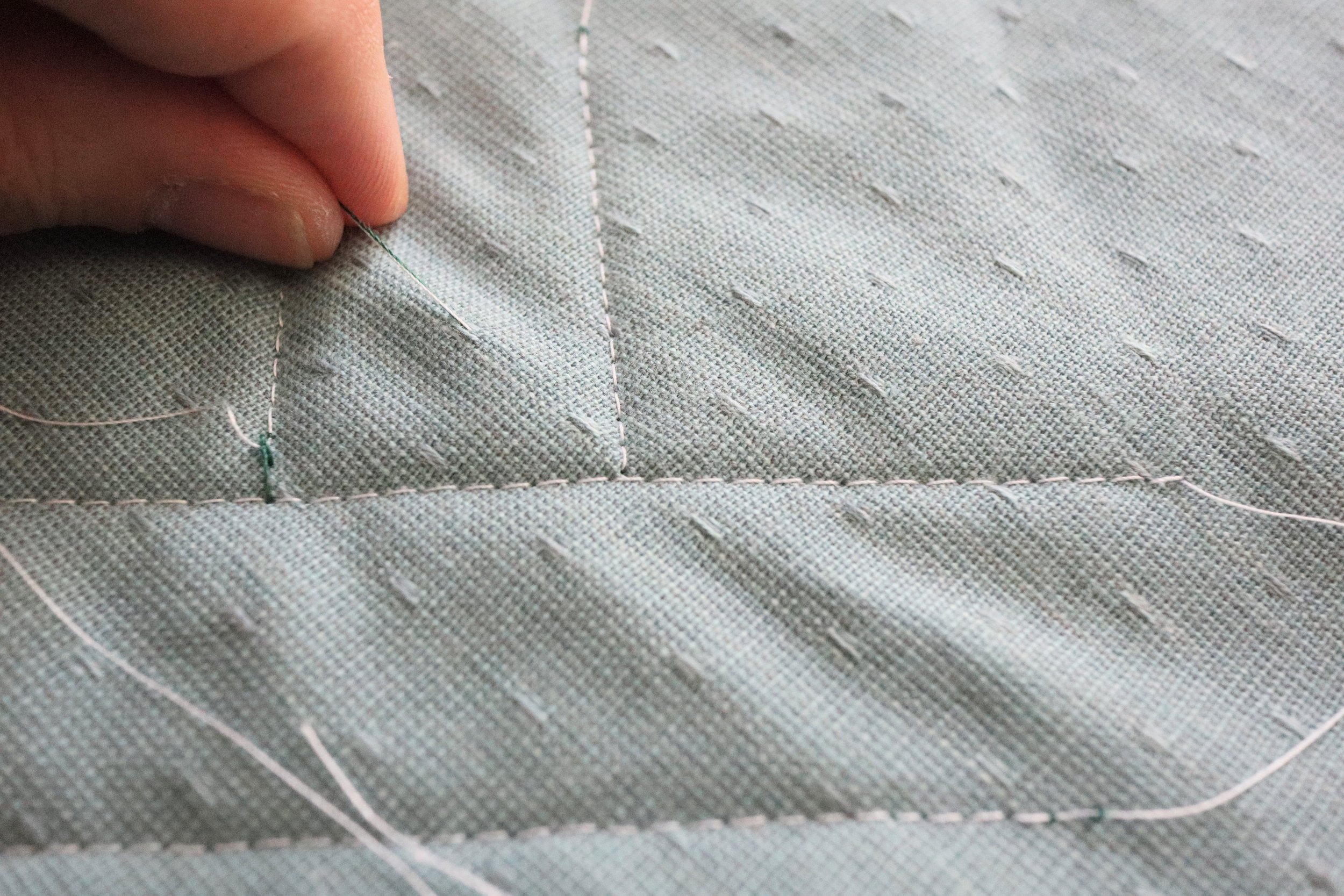 Pull lightly to pop the knot between the layers.