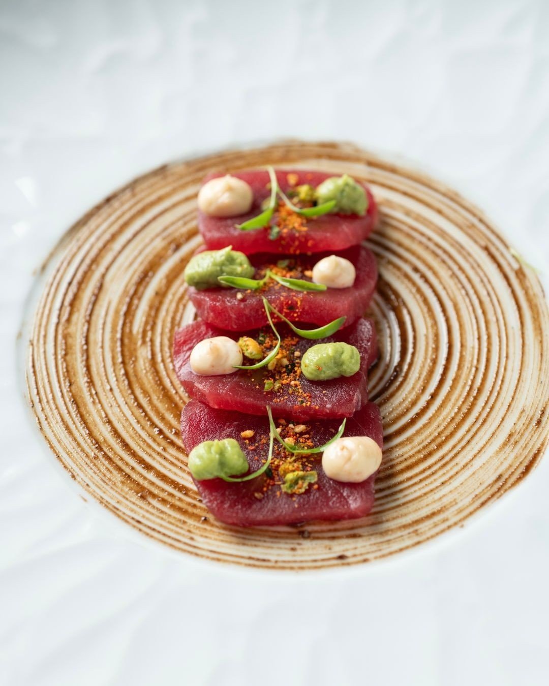 Local flavors meet bold surprises in our Tuna Sashimi &mdash; black garlic, ponzu, avocado, wasabi, and sesame come together for a clean bite with a rich, unexpected finish. 🌿

📸: @douglasmerriam