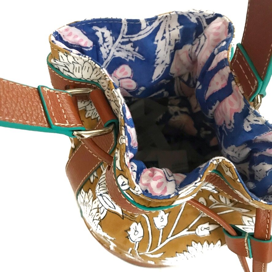 handcrafted leather drawstring bucket bag combined with cotton blockprint fabric