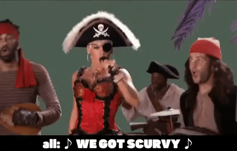 P!NK and three pirates in colorful costumes singing, with the caption 'We Got Scurvy' emphasizing the importance of vitamin C in preventing deficiency diseases.