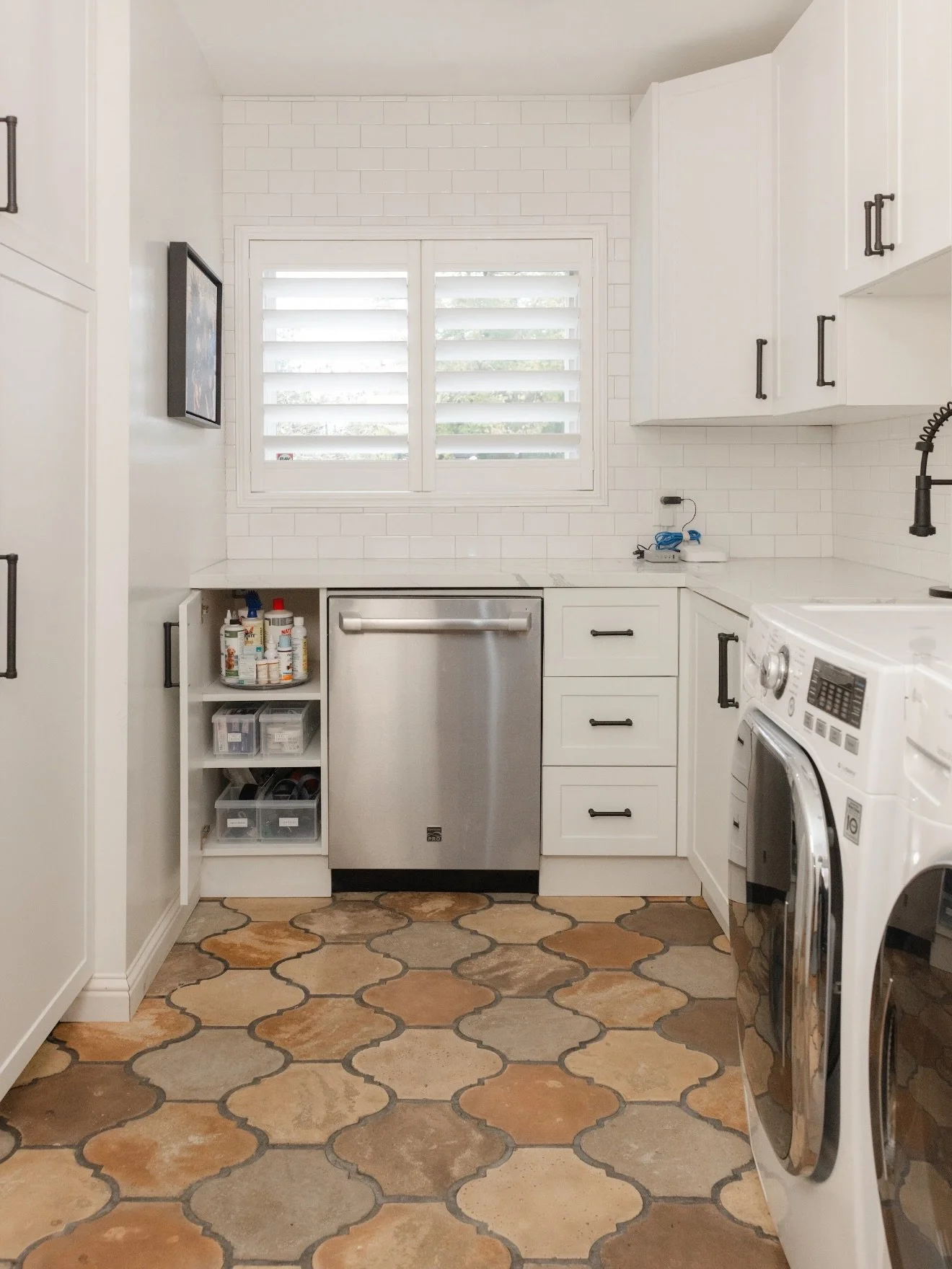 Before, this laundry room was doing all the jobs&hellip; but without a system to support it.
After, it&rsquo;s a calm, functional space that actually works for everyday life.

This room needed to store pet supplies, picnic items, paper goods, cleanin