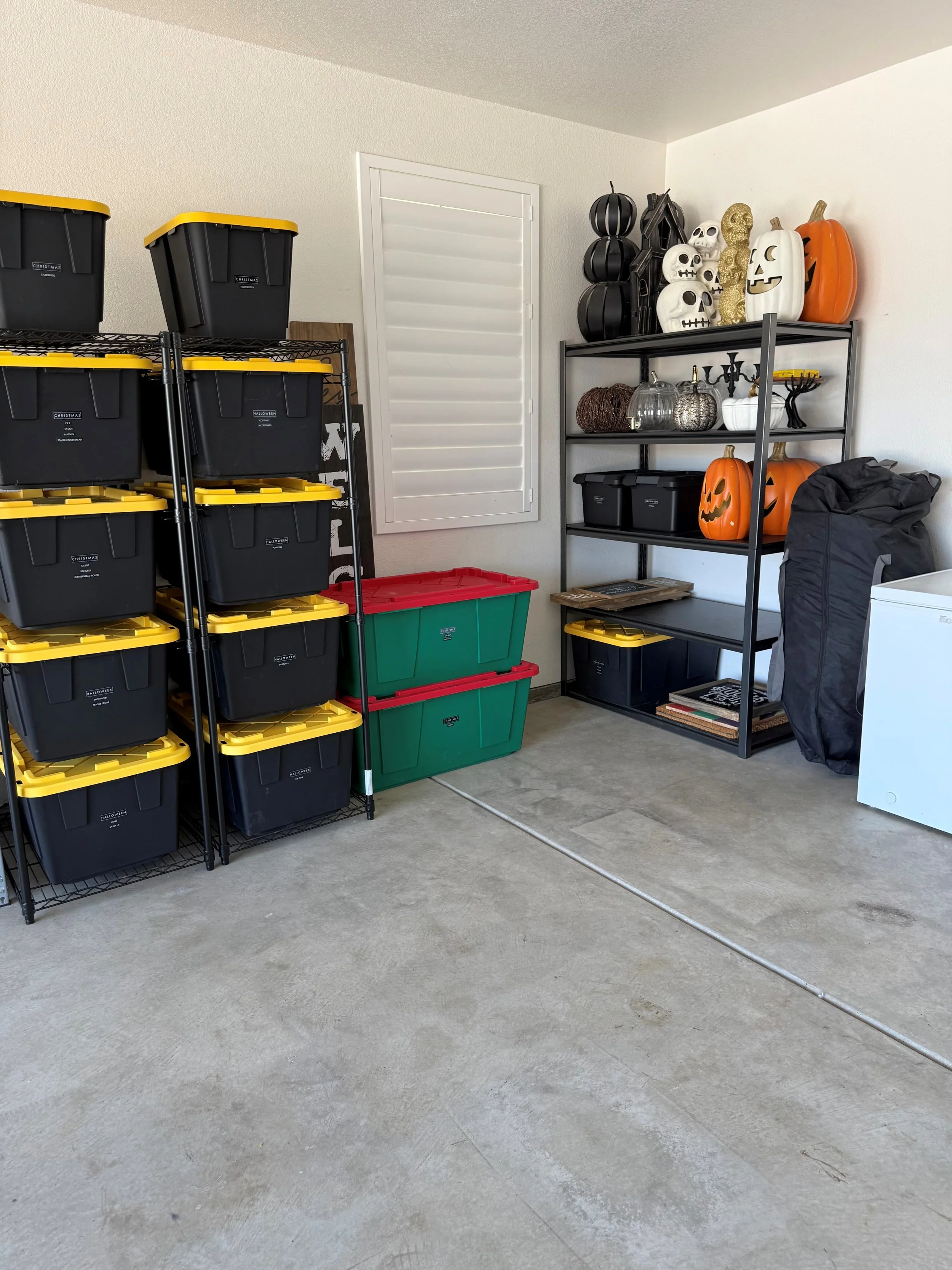 Garage storage with clearly labeled bins of holiday decor, organized by The Simple House in Lodi and Stockton, CA