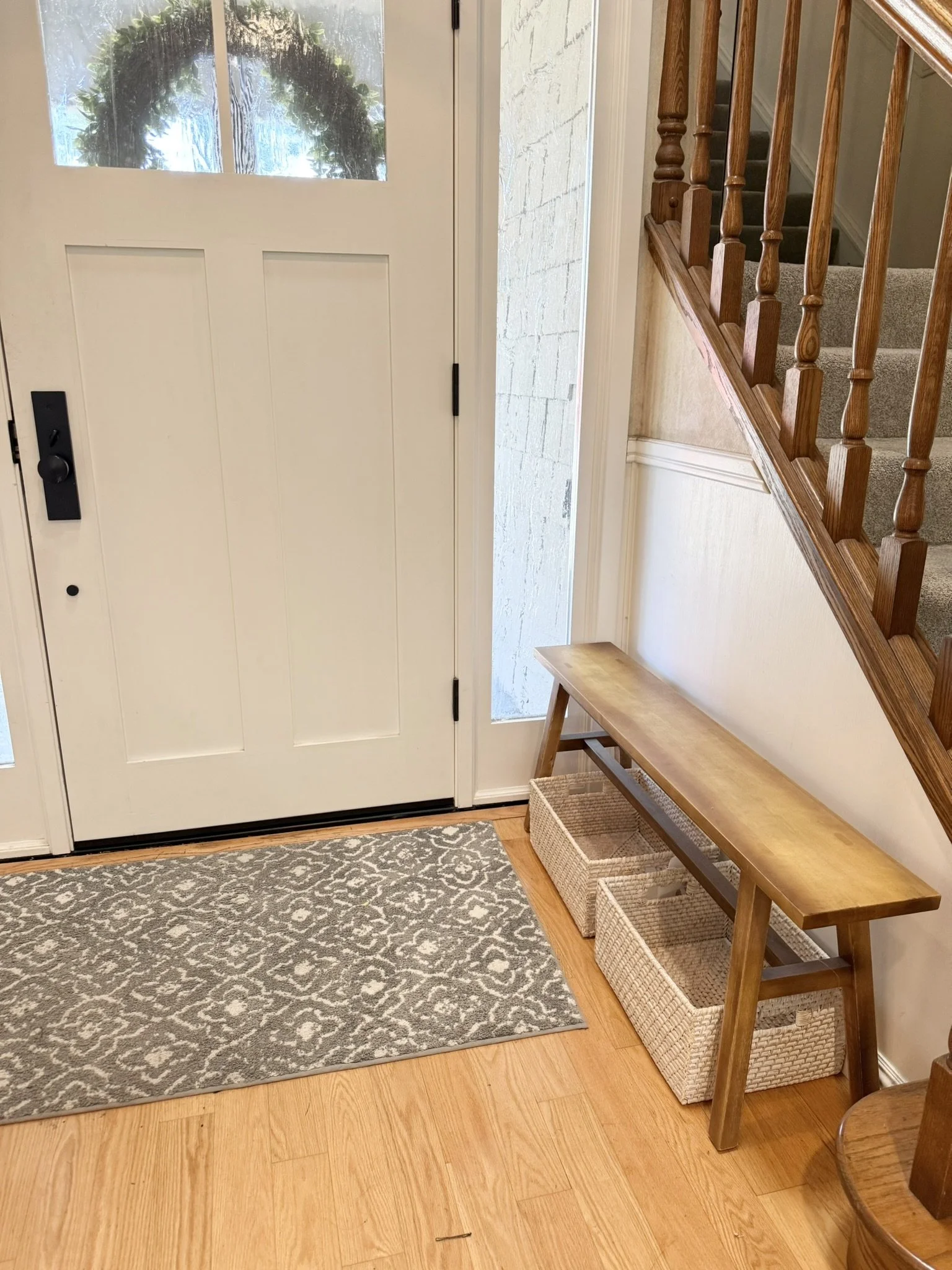 Organized entryway drop zone with hooks and baskets for busy family mornings, by The Simple House in Stockton, CA