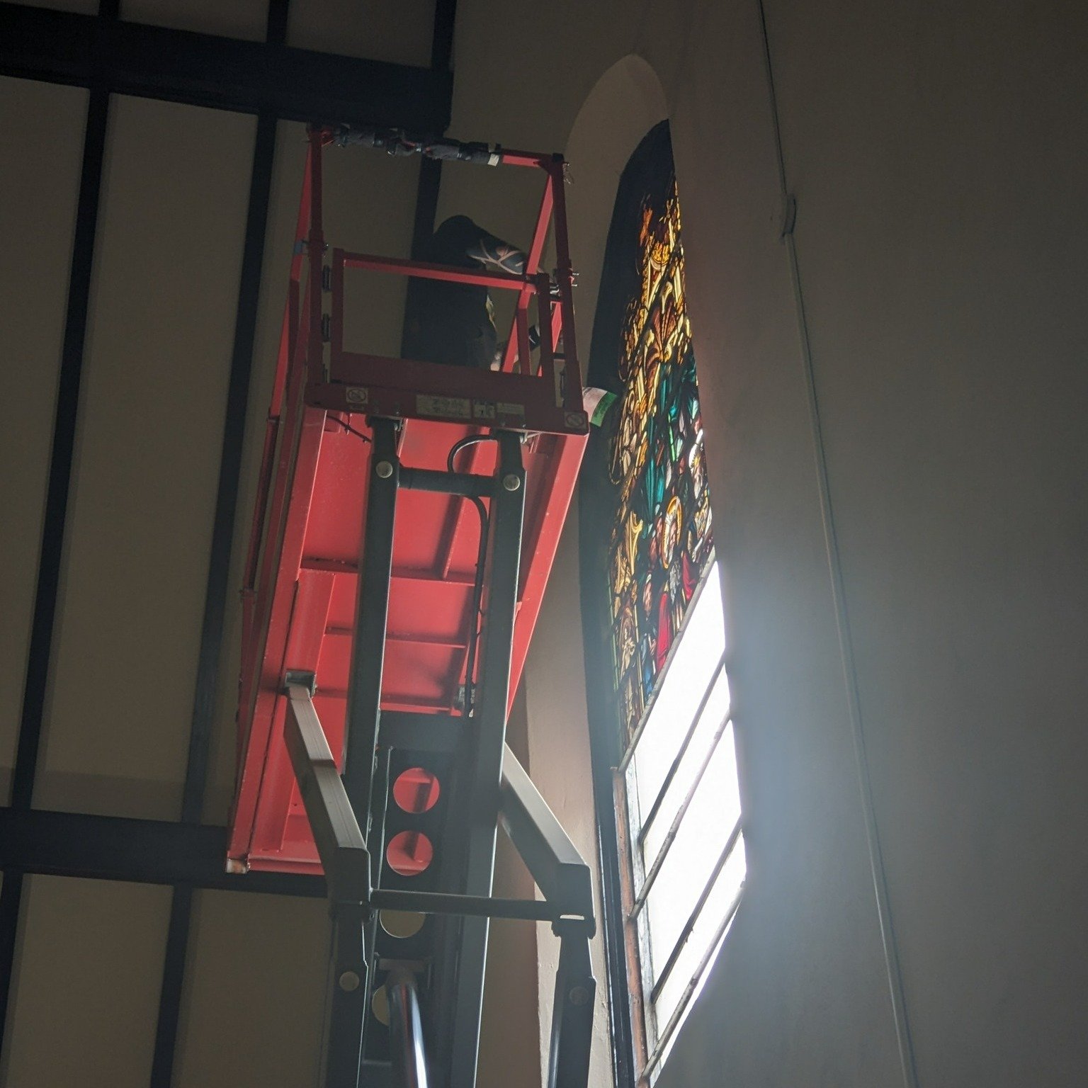 Two of our magnificent windows, on the west wall, and above the high altar on the east wall, have recently been removed for repairs and maintenance. Over the 123 and 98 years (respectively) that the windows have graced our church, the weight of the g