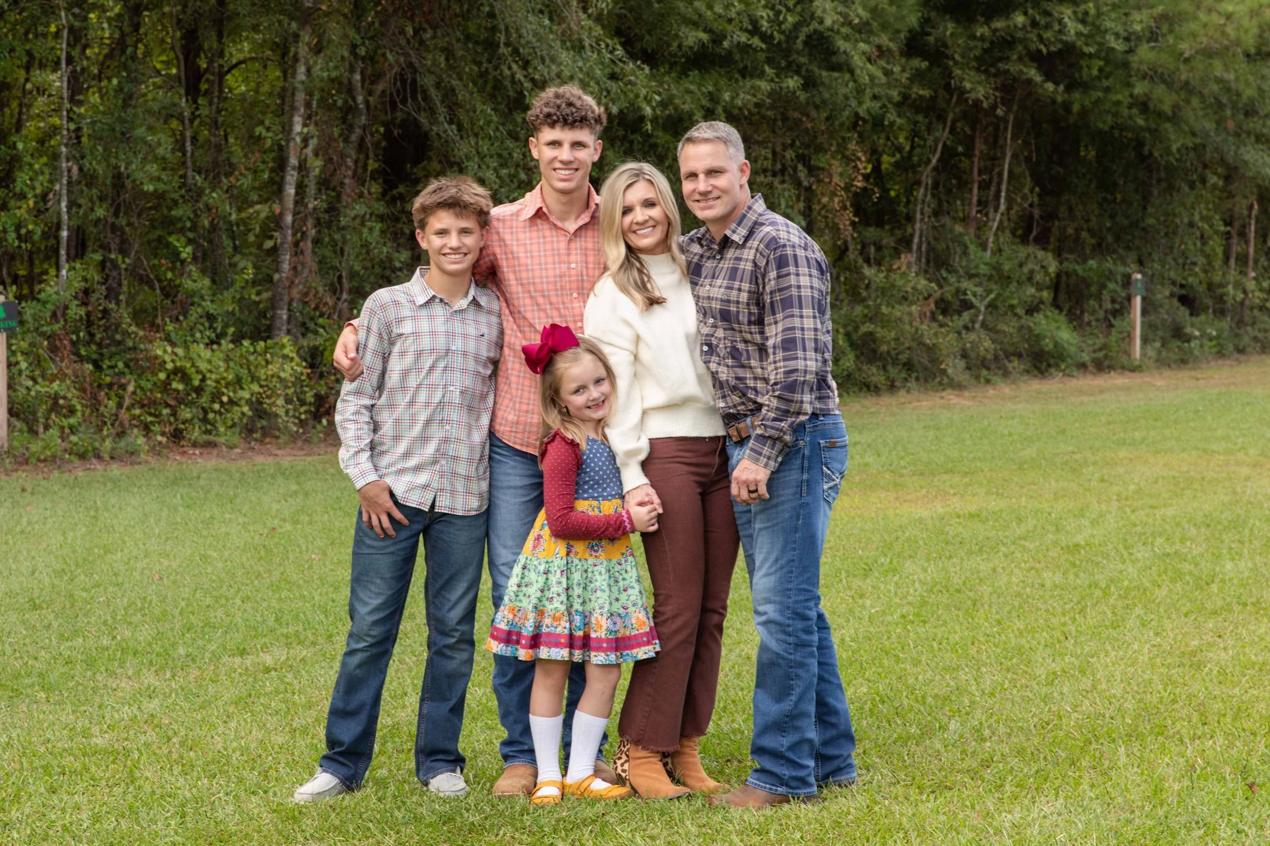 family portrait session with three kids at a tree farm in chapin, sc.