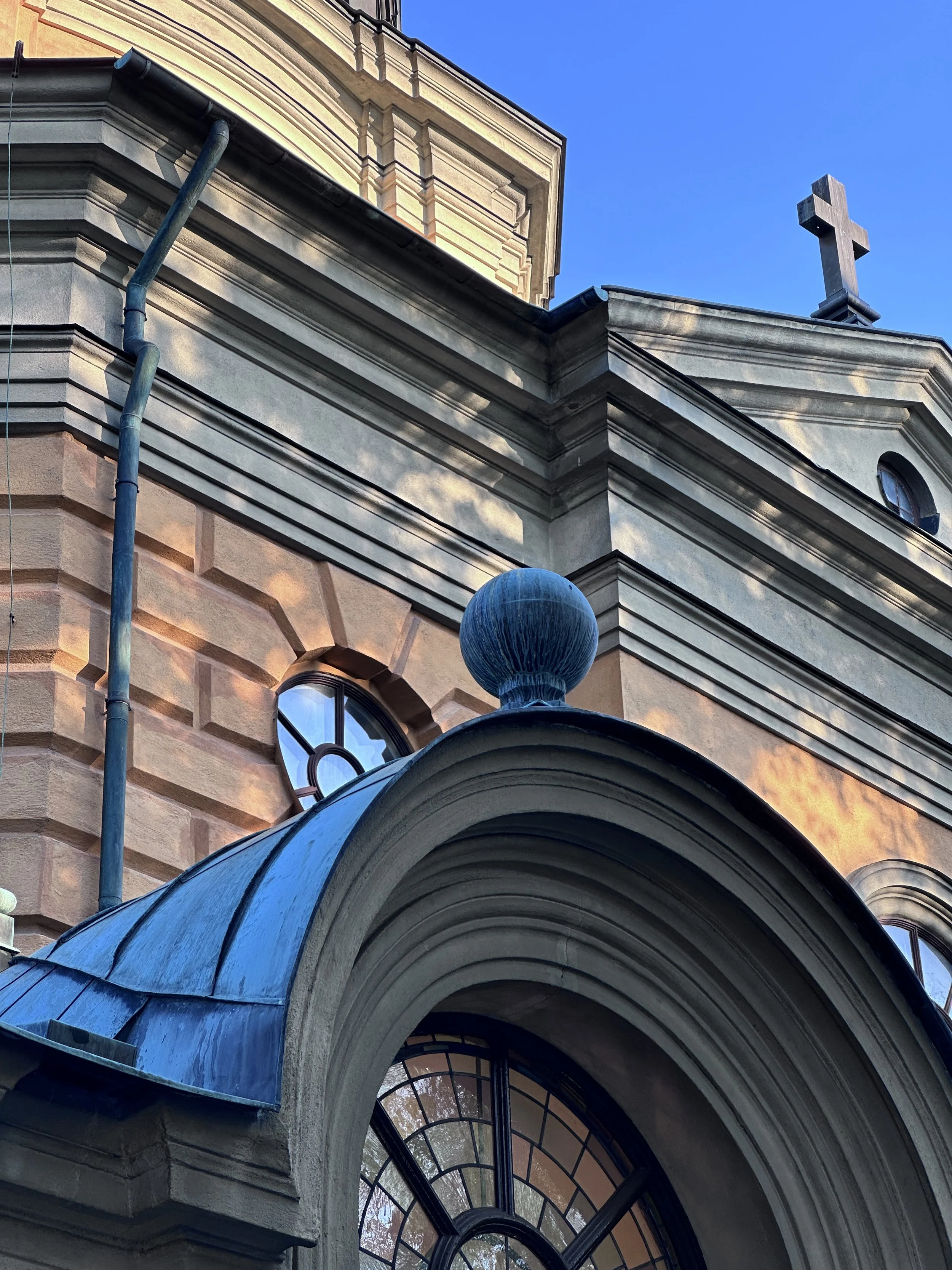  Historic Stockholm church facade with arched windows and morning sunlight 